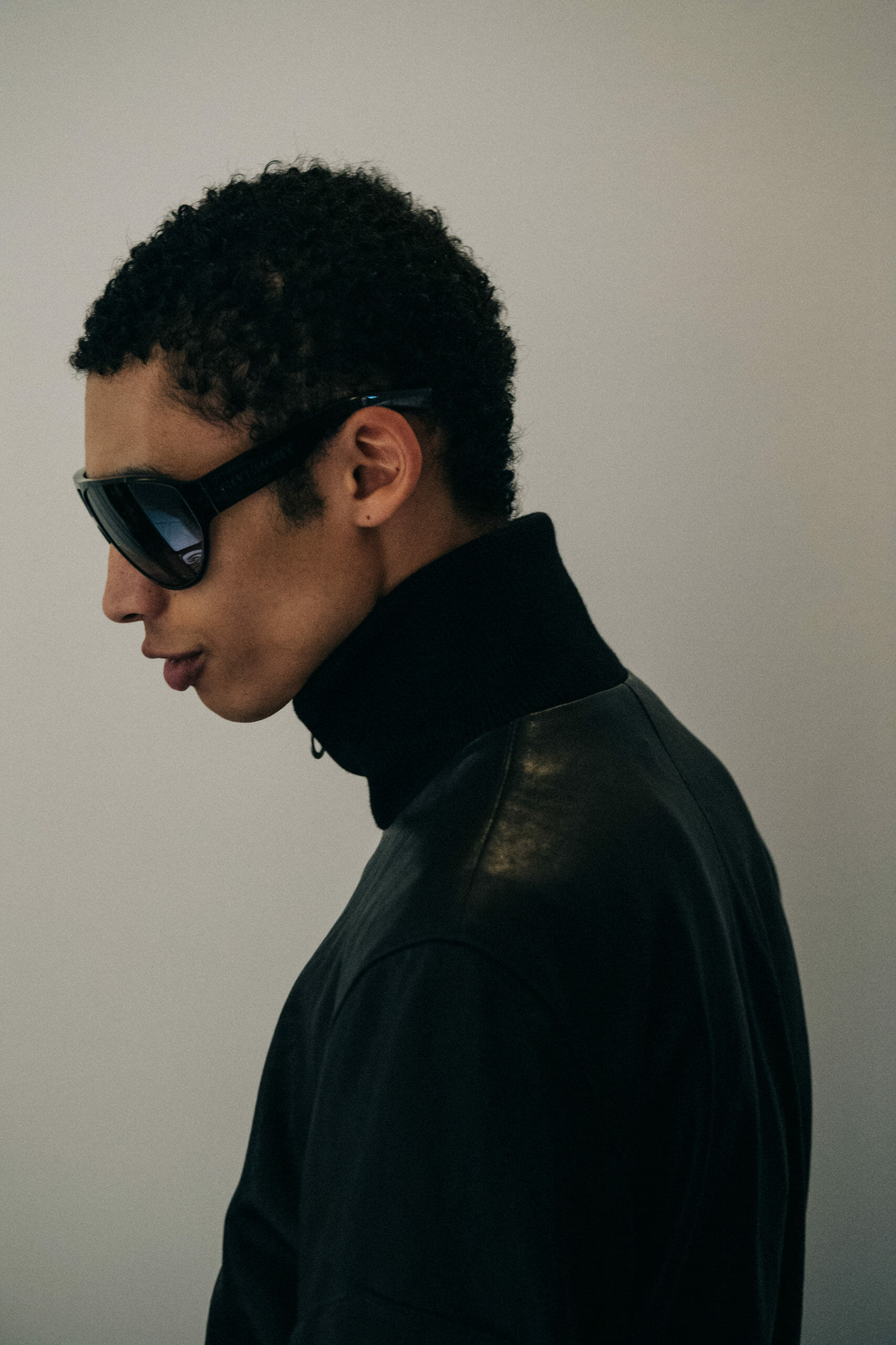 Model wearing black leather jacket