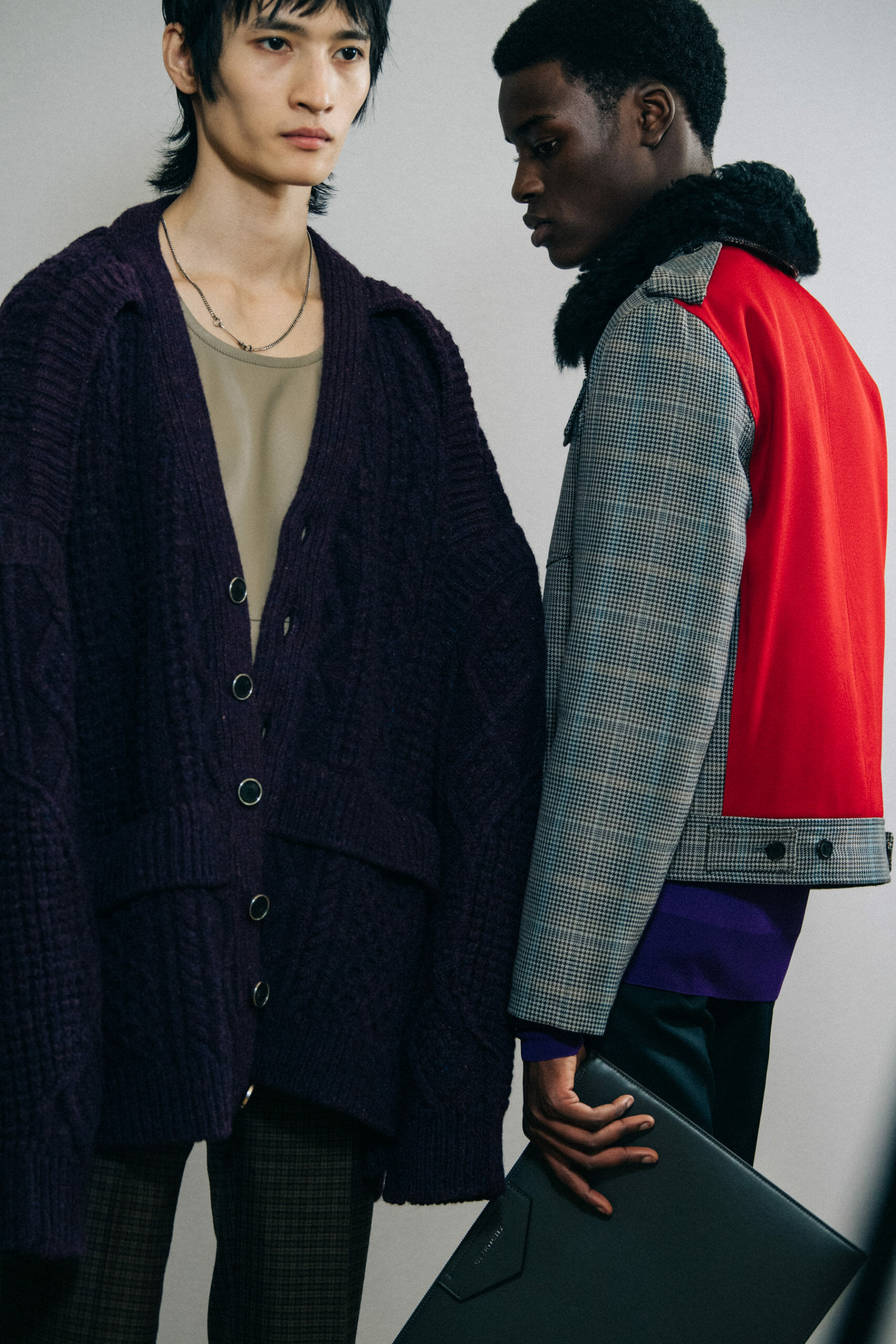 Model wearing grey check jacket