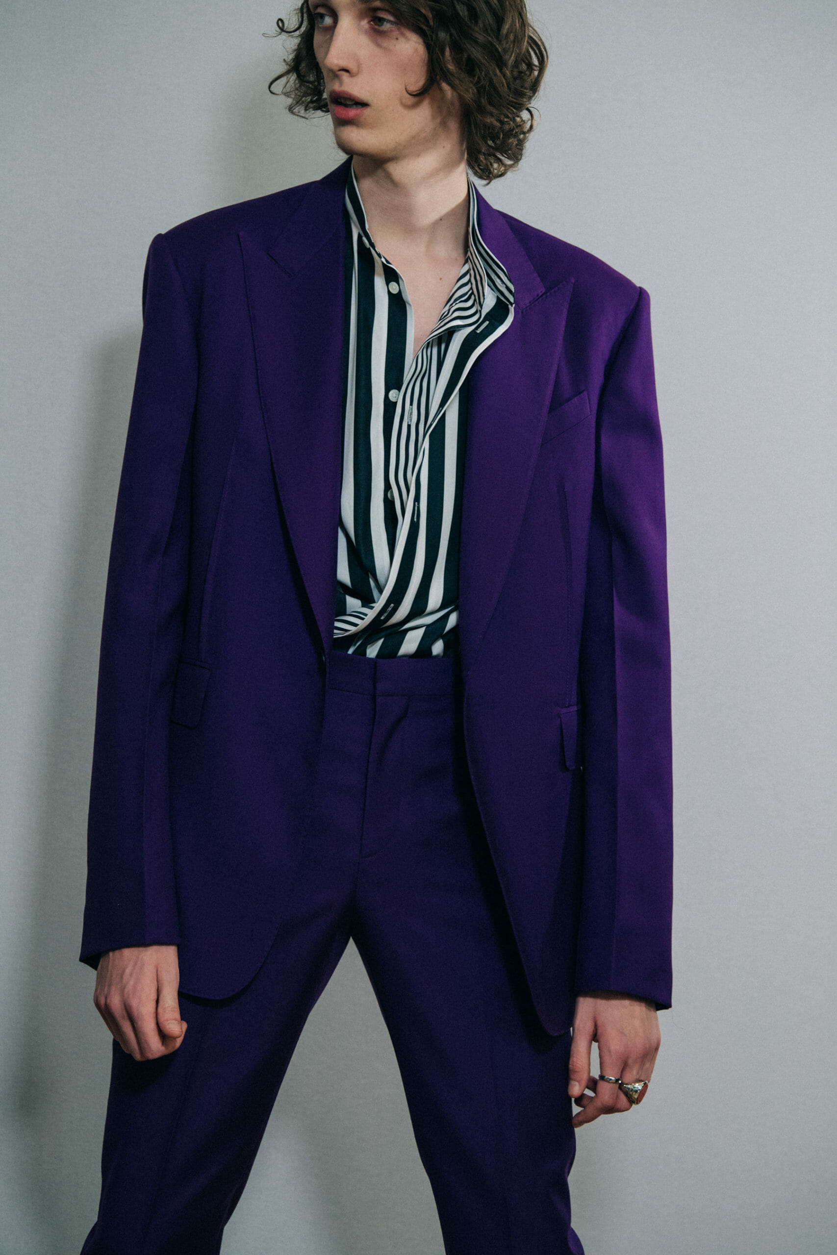 Model wearing purple suit