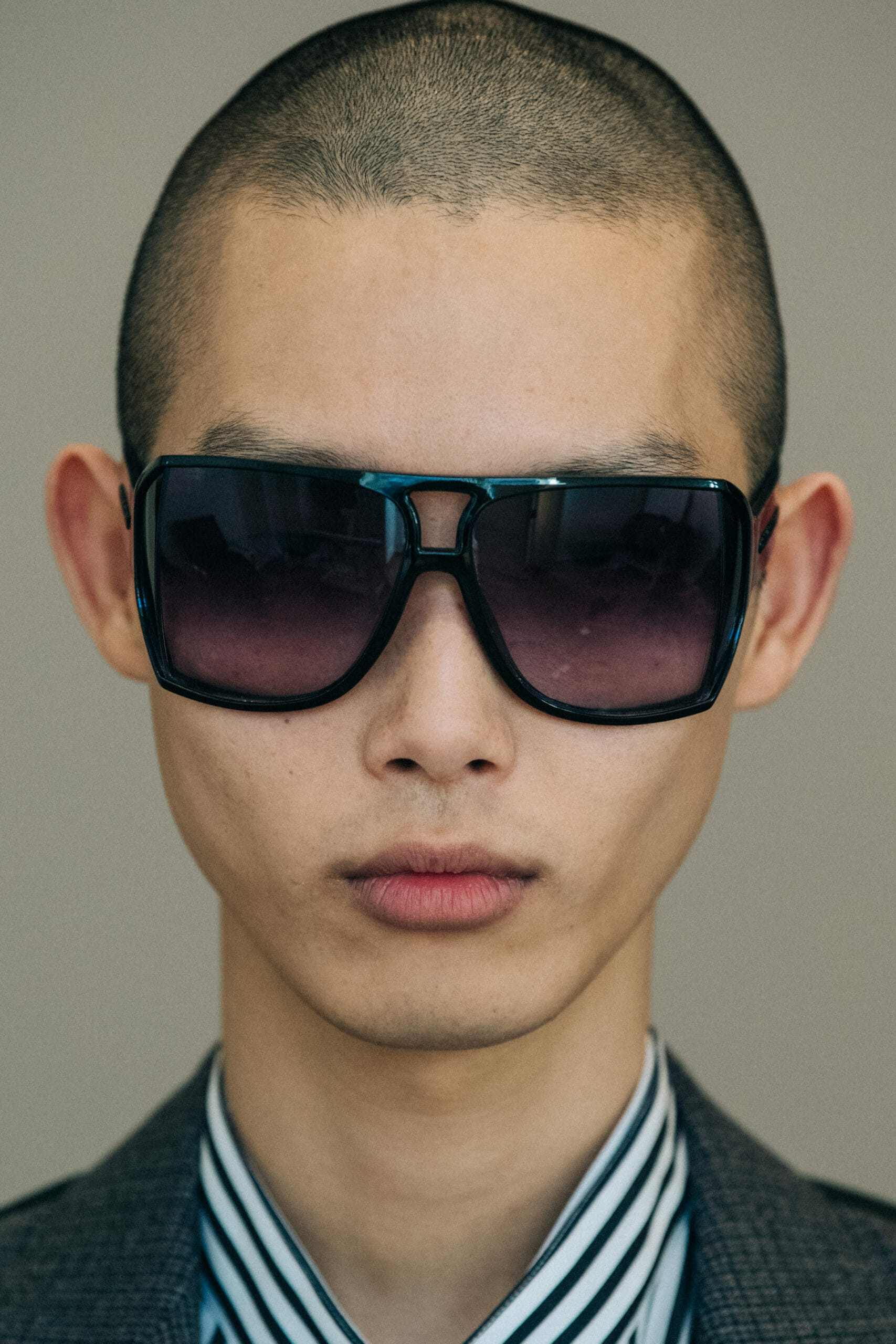 Model wearing grey suit jacket