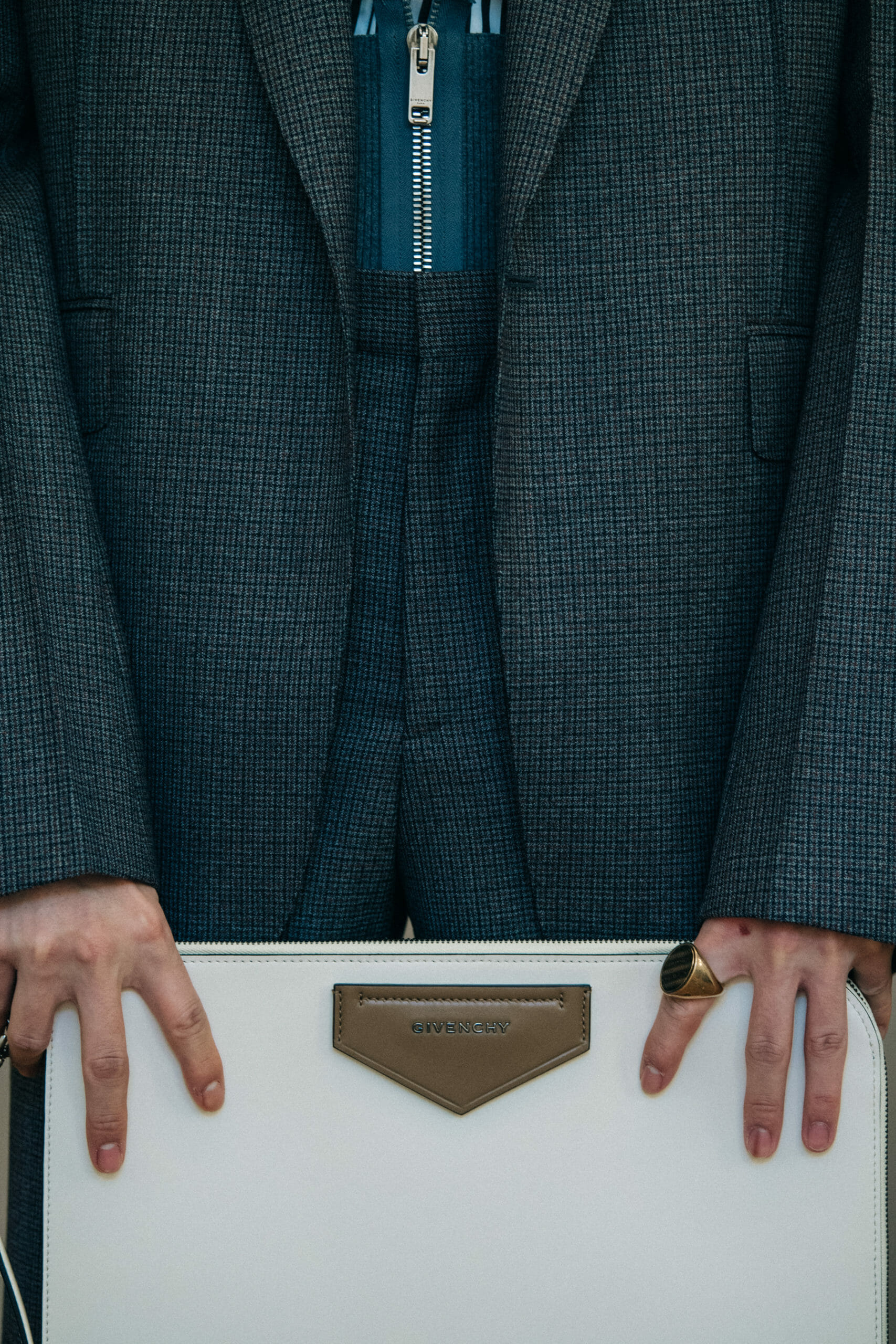 Model wearing grey suit jacket