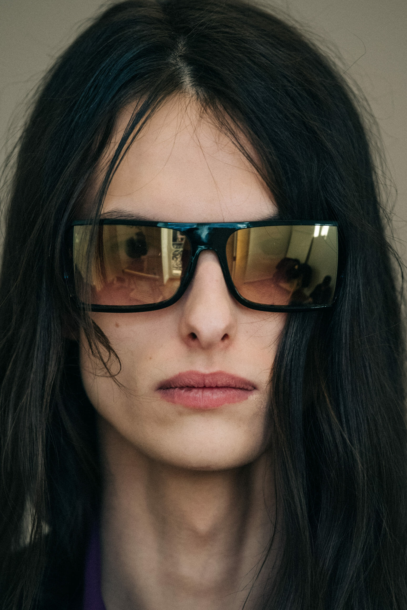 Model wearing Givenchy glasses