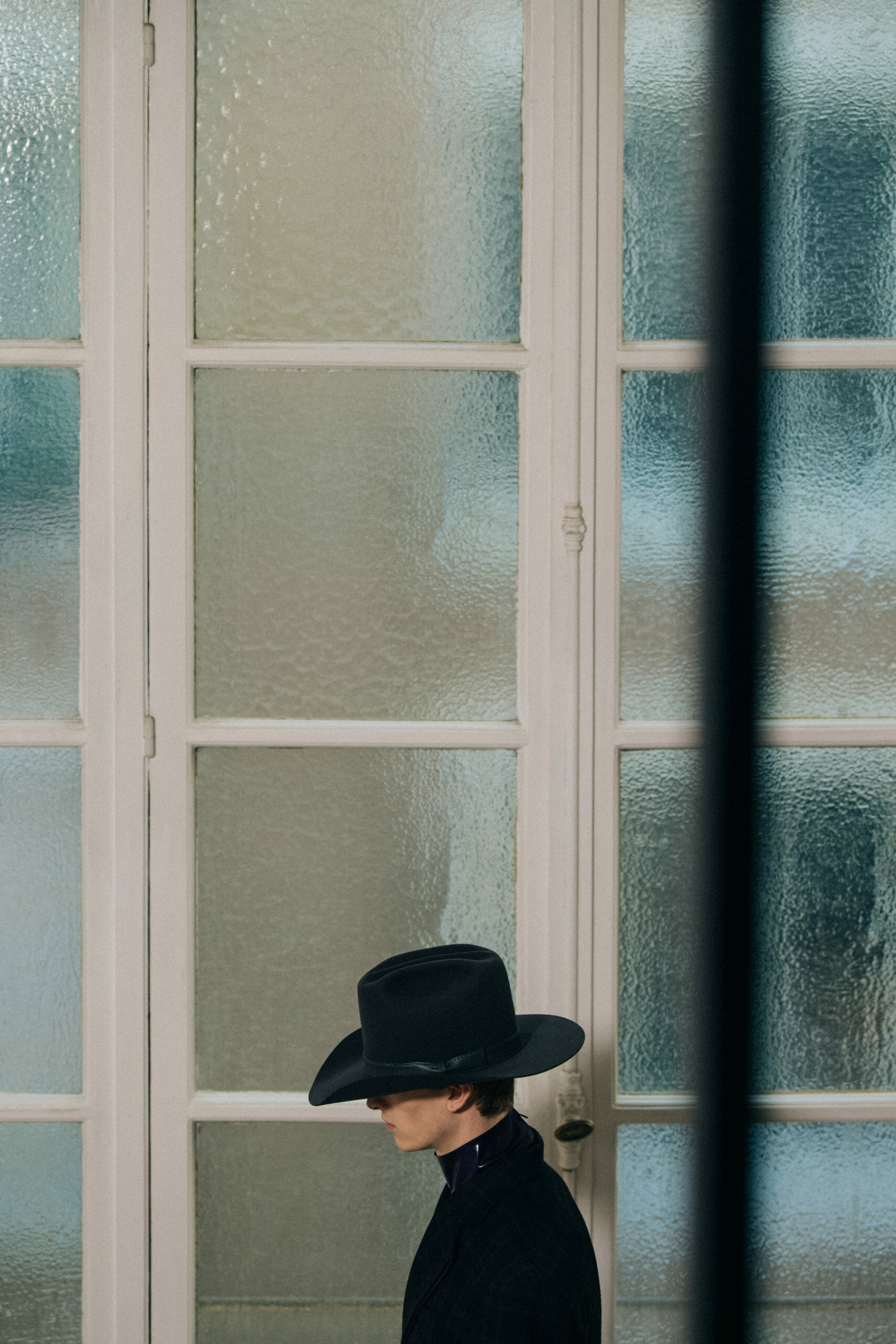 Model wearing cowboy hat at Givenchy