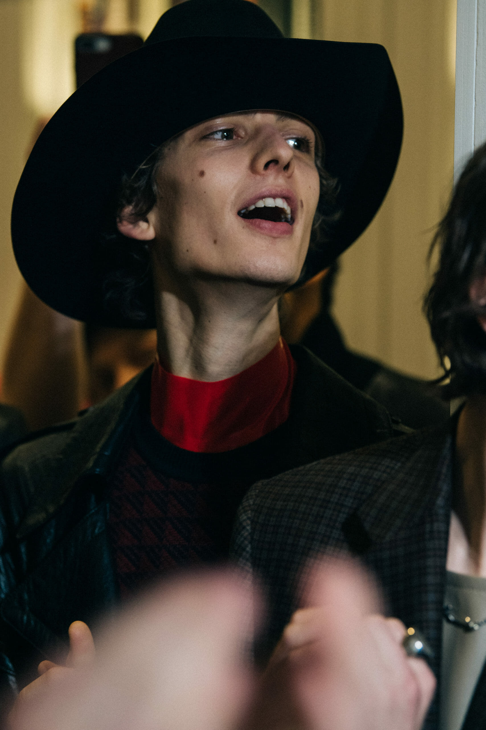 Model wearing cowboy hat
