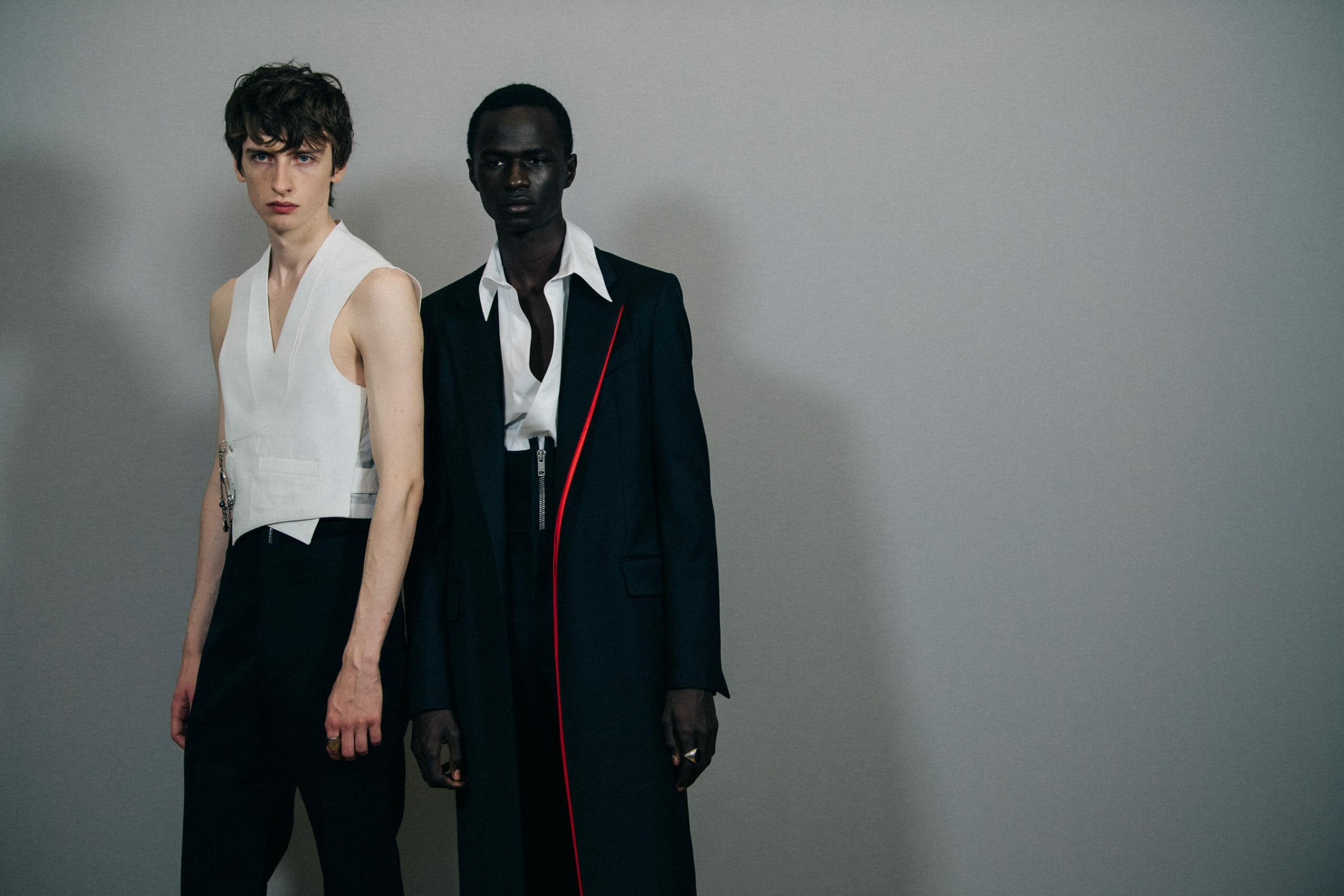 Model wearing long black coat