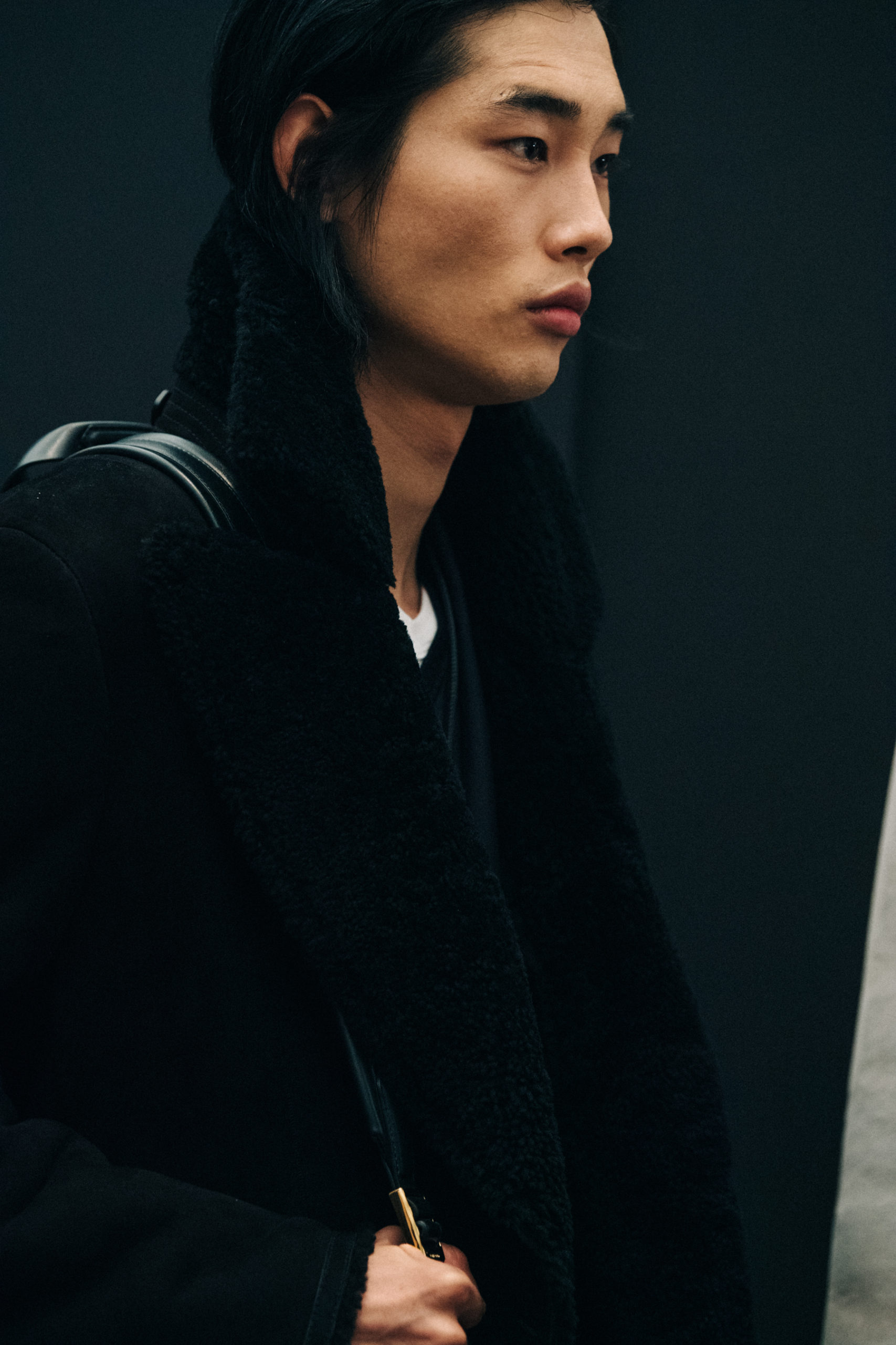 Model wearing black outfit