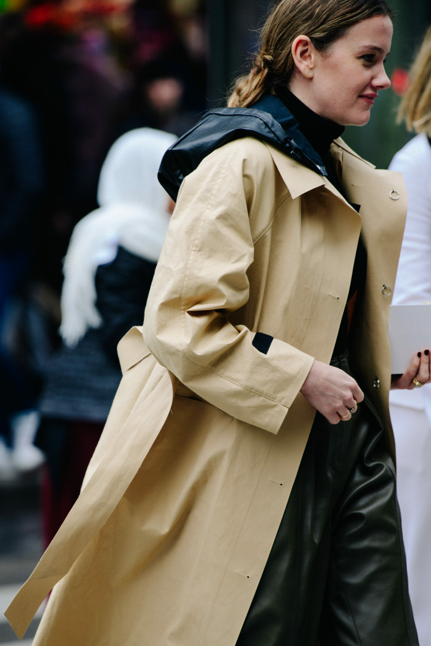 Woman wearing tan coat
