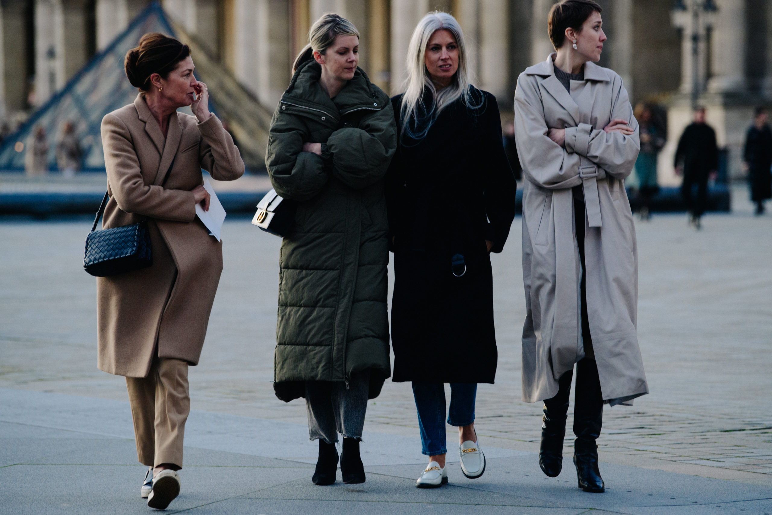 Women wearing long winter coats