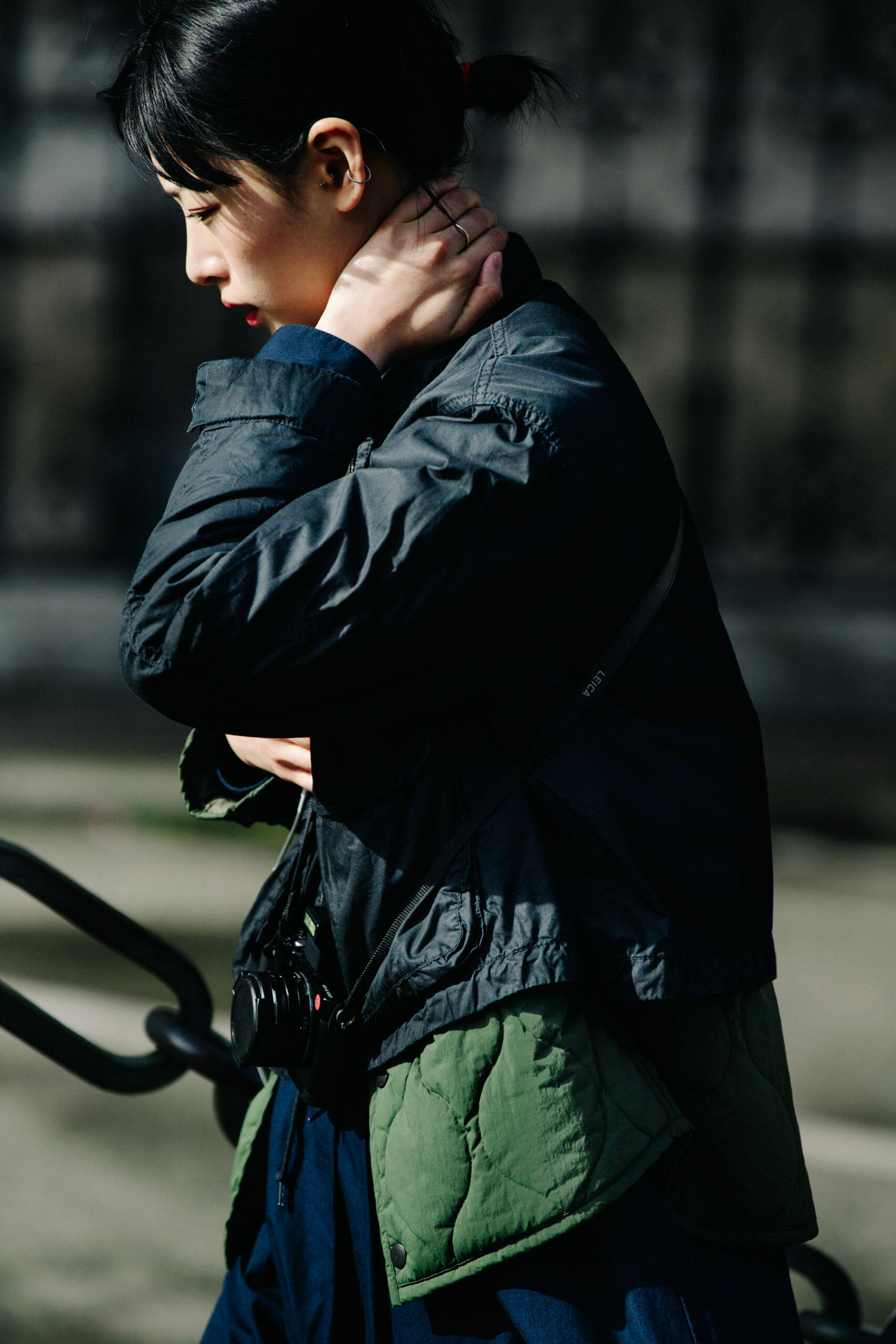 Woman wearing black and green