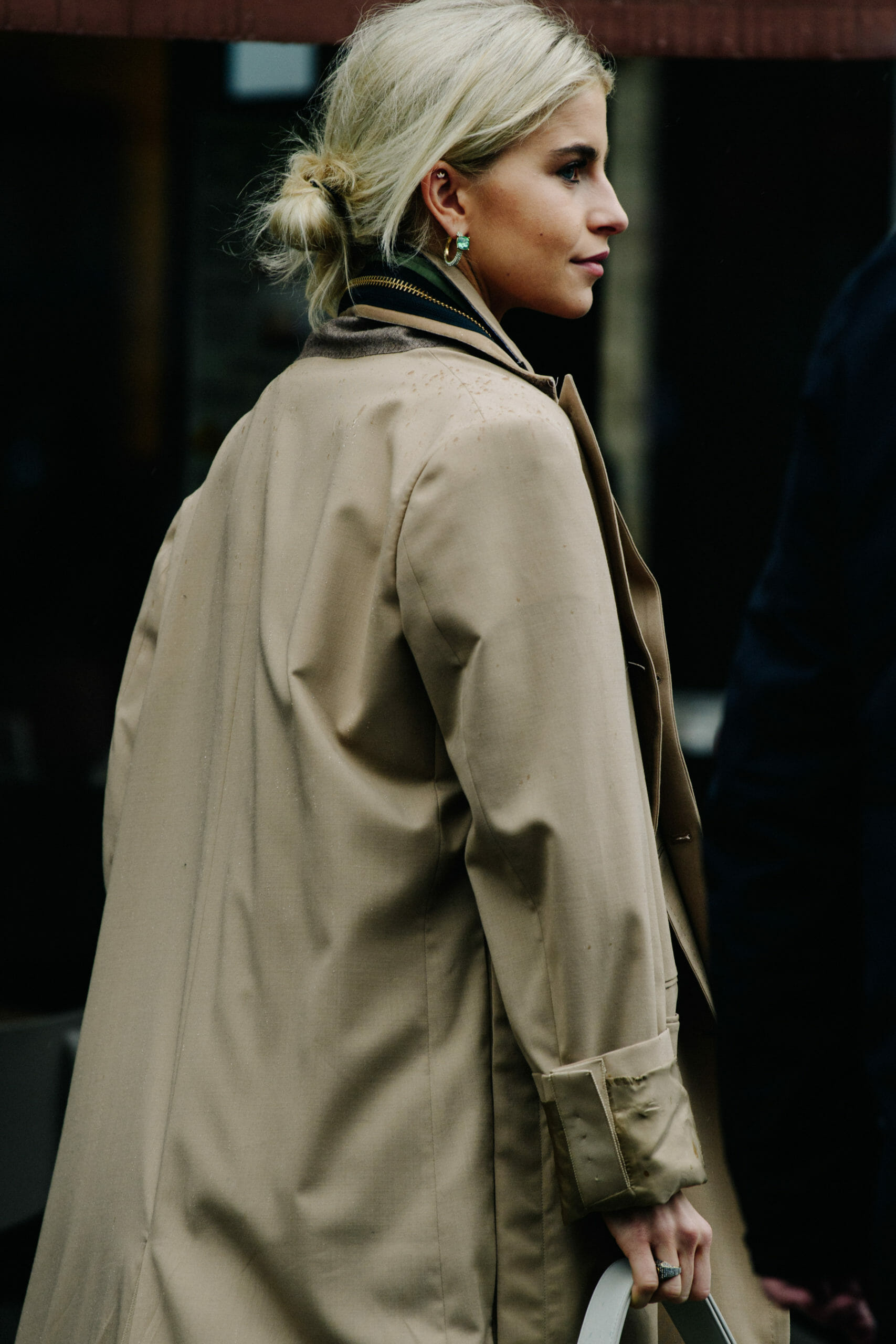 Woman wearing tan coat