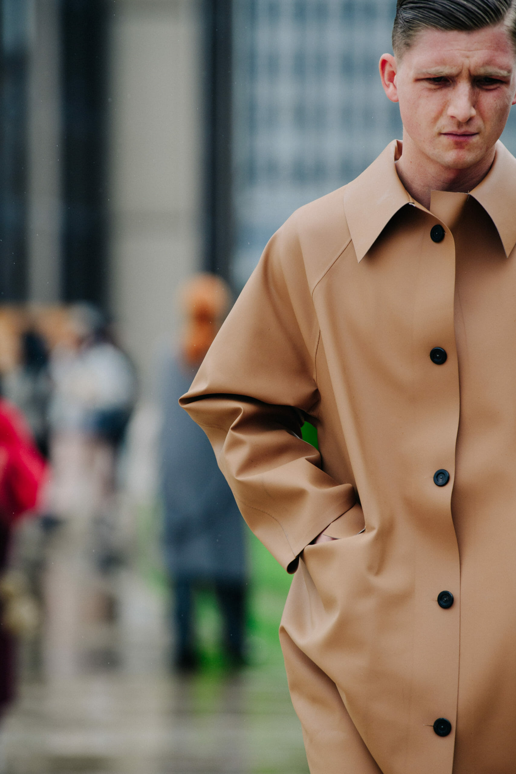 Man wearing tan coat