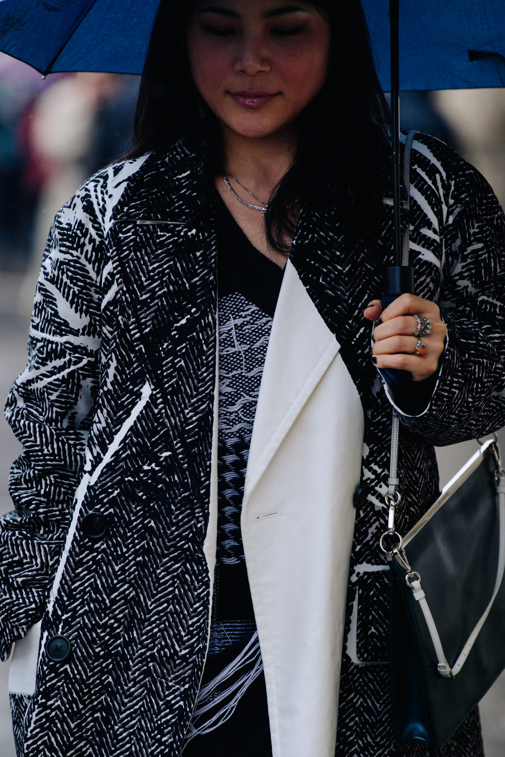 Woman wearing black and white coat