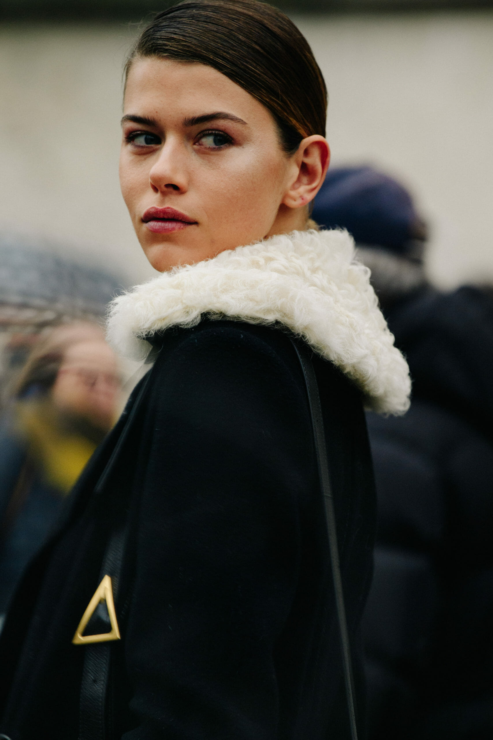 Model wearing fur trim coat
