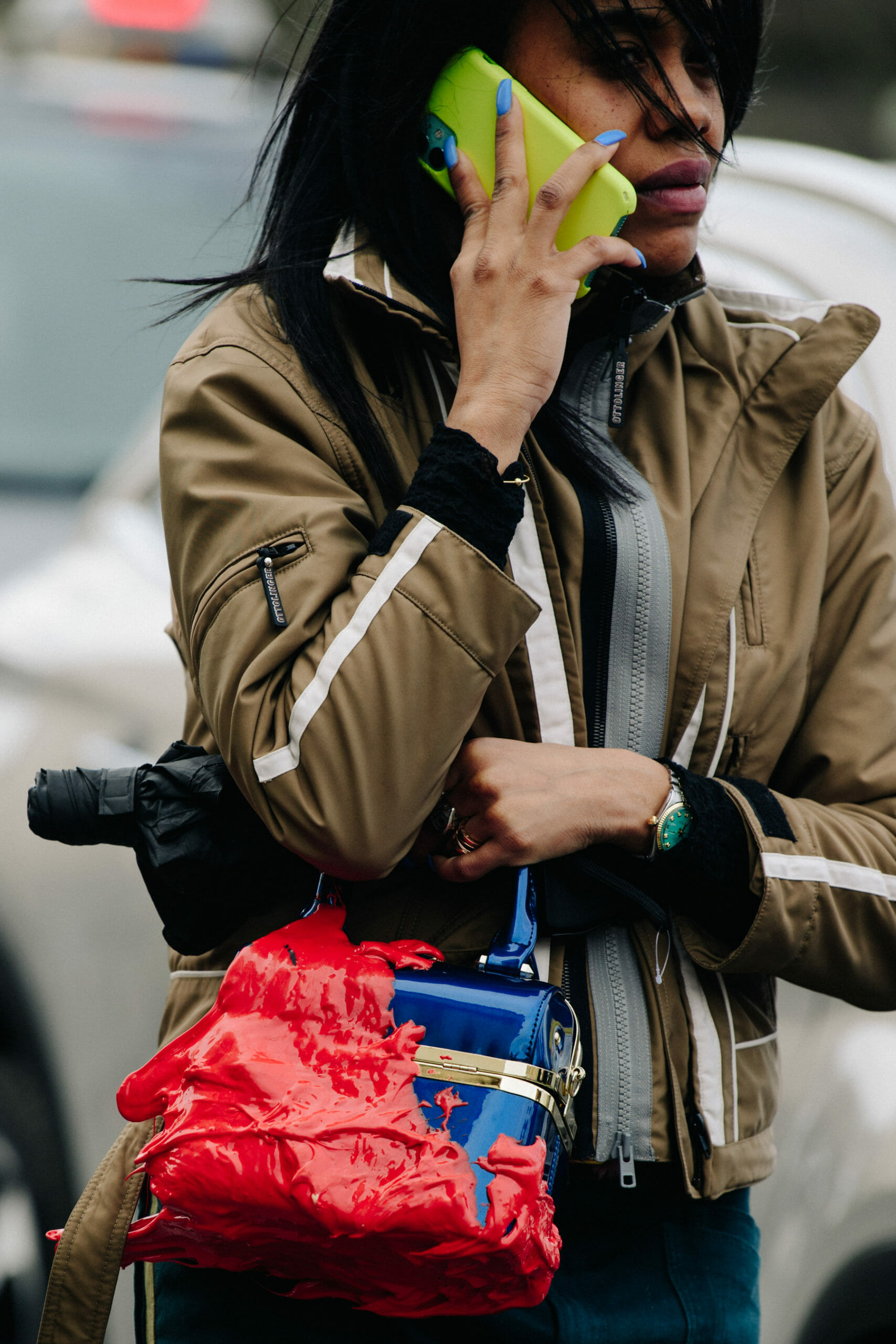 Woman carrying blue bag