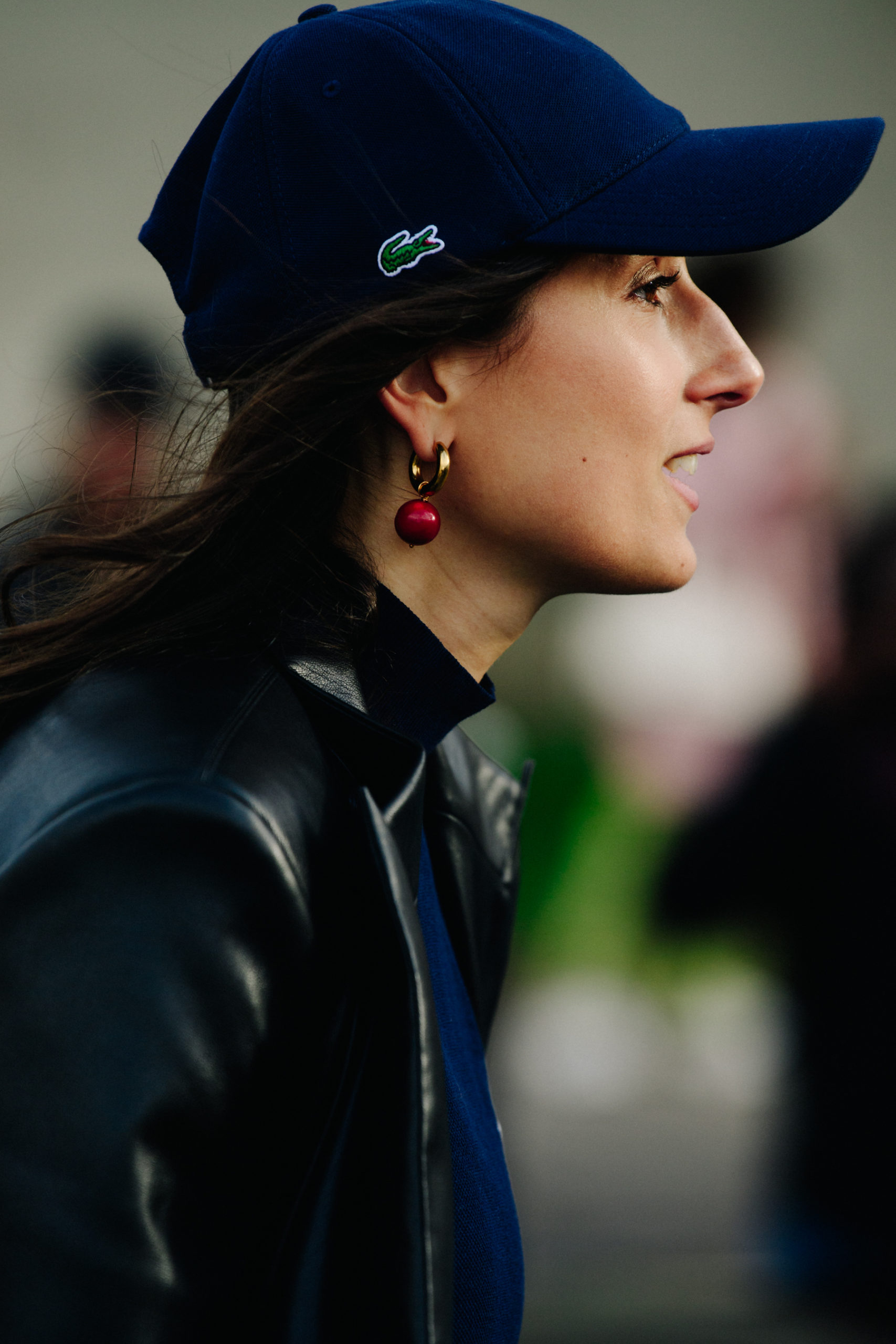 Woman wearing Lacoste cap