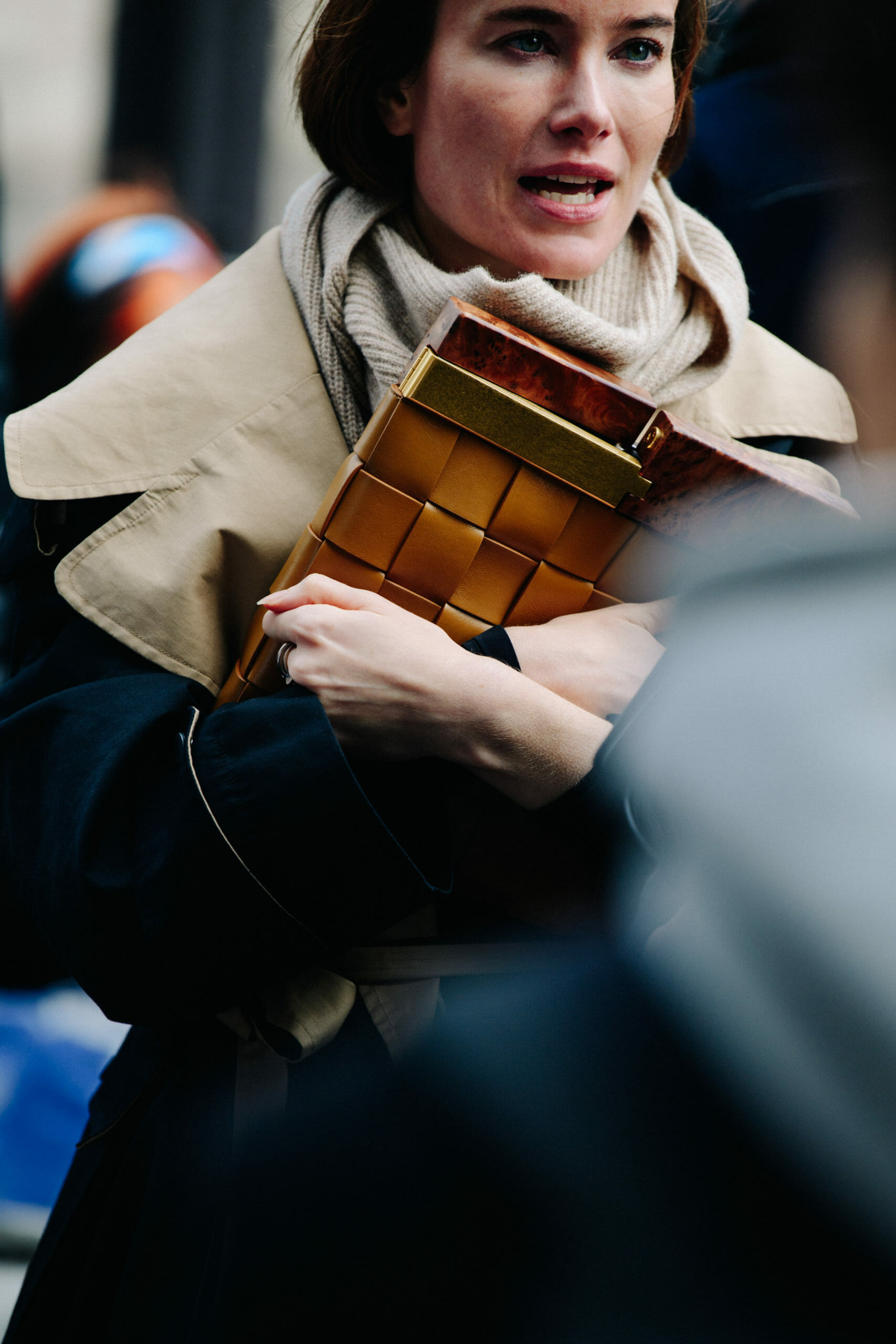 Woman carrying brown bag