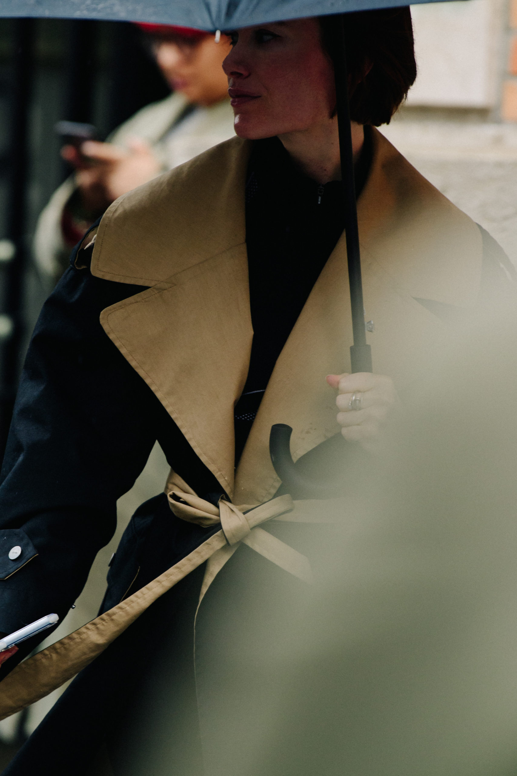 Woman wearing tan coat