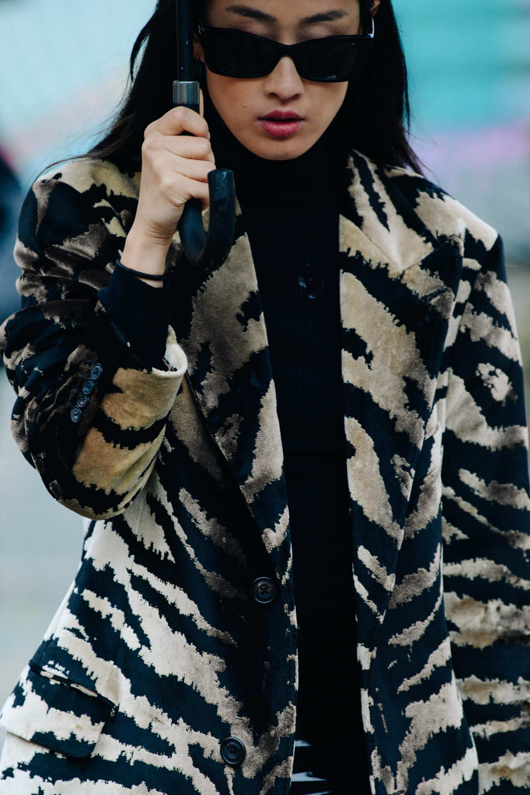 Woman wearing striped jacket