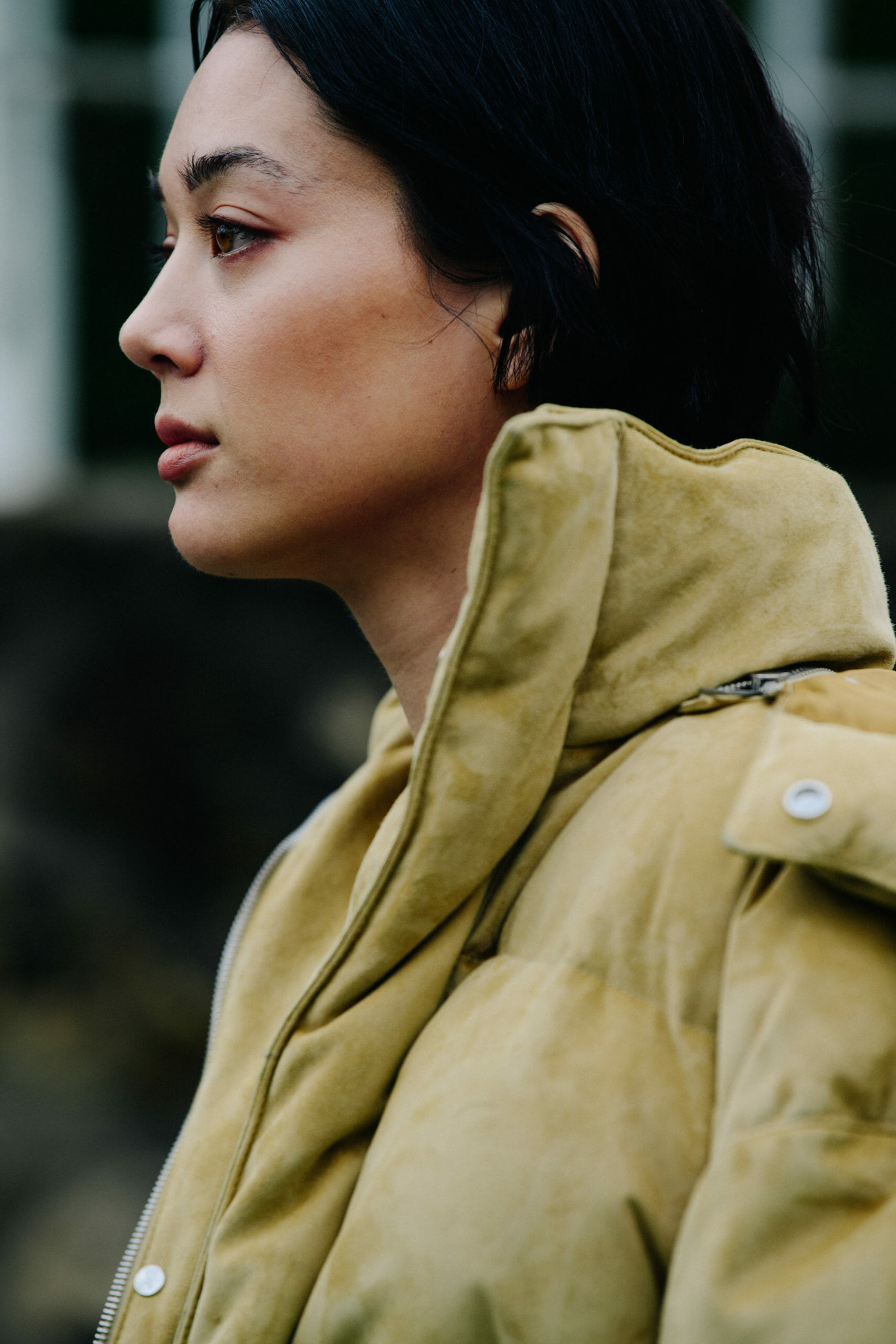 Woman wearing tan coat
