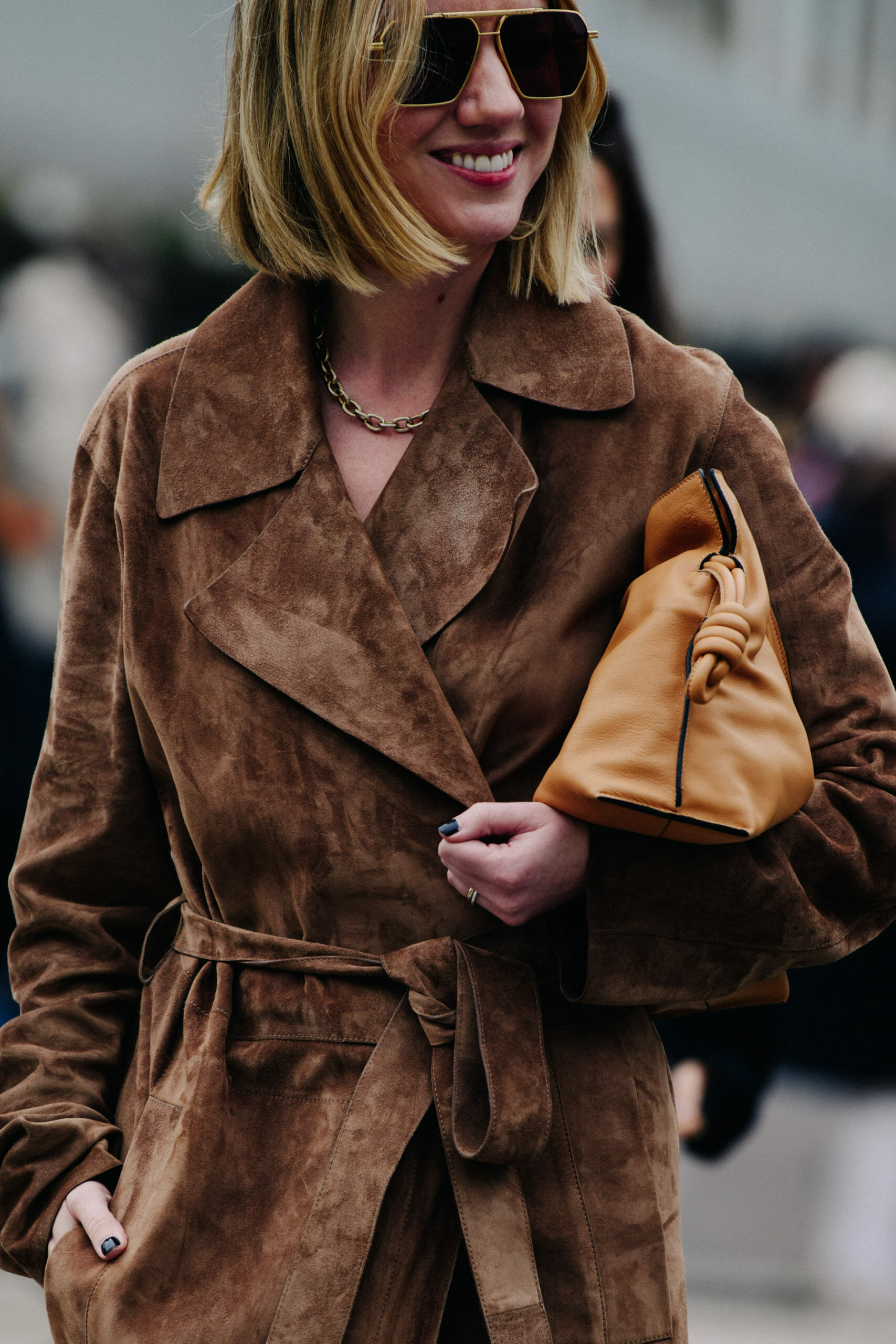 Woman wearing brown suede coat