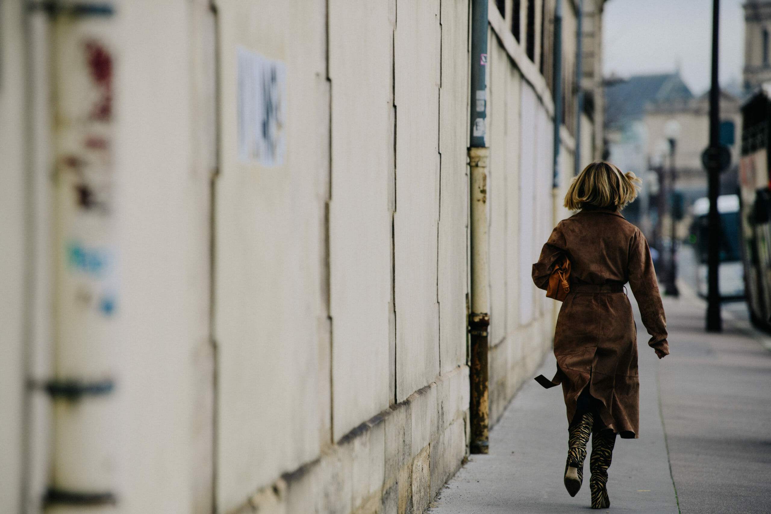 Woman wearing brown suede coat