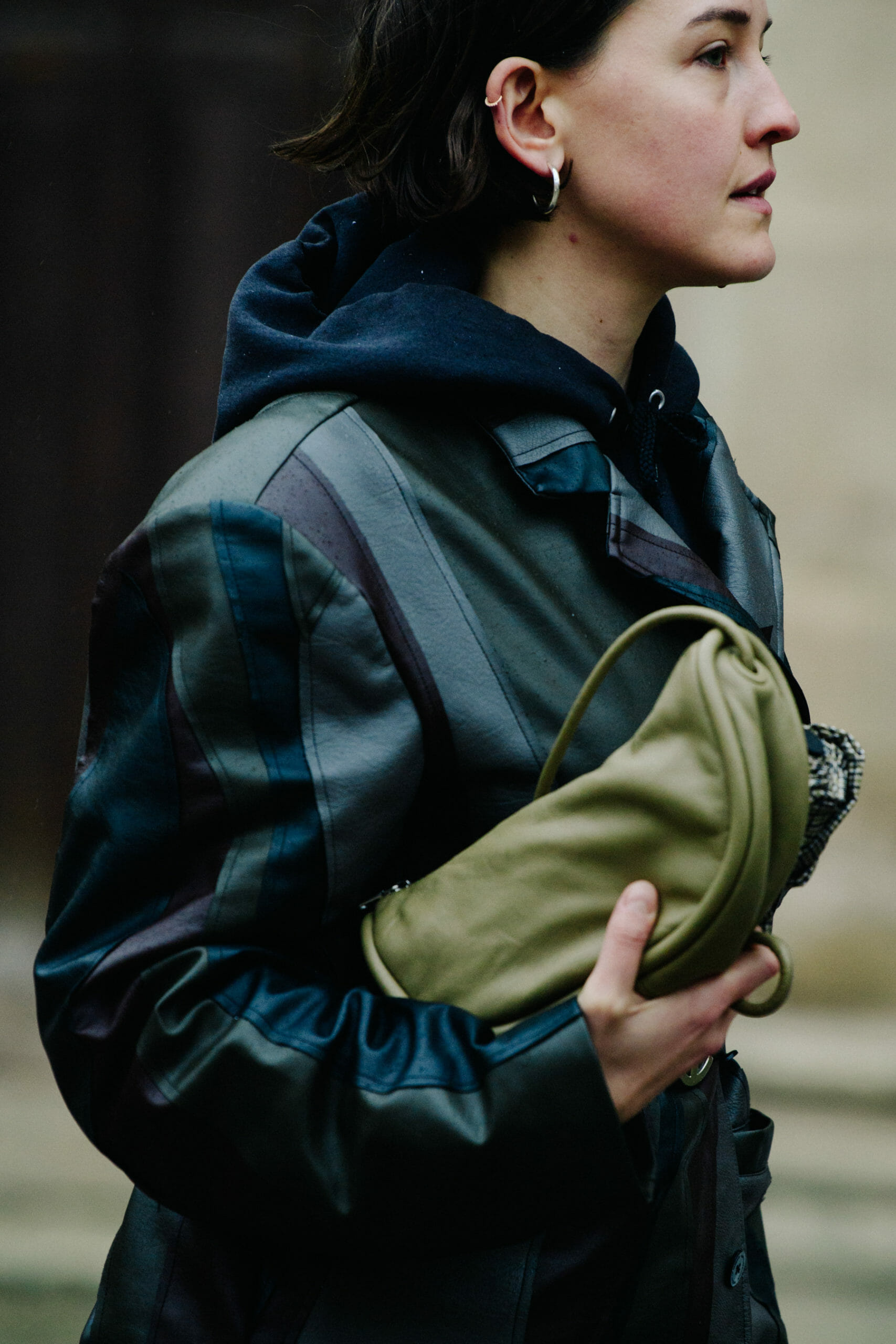 Woman carrying green bag