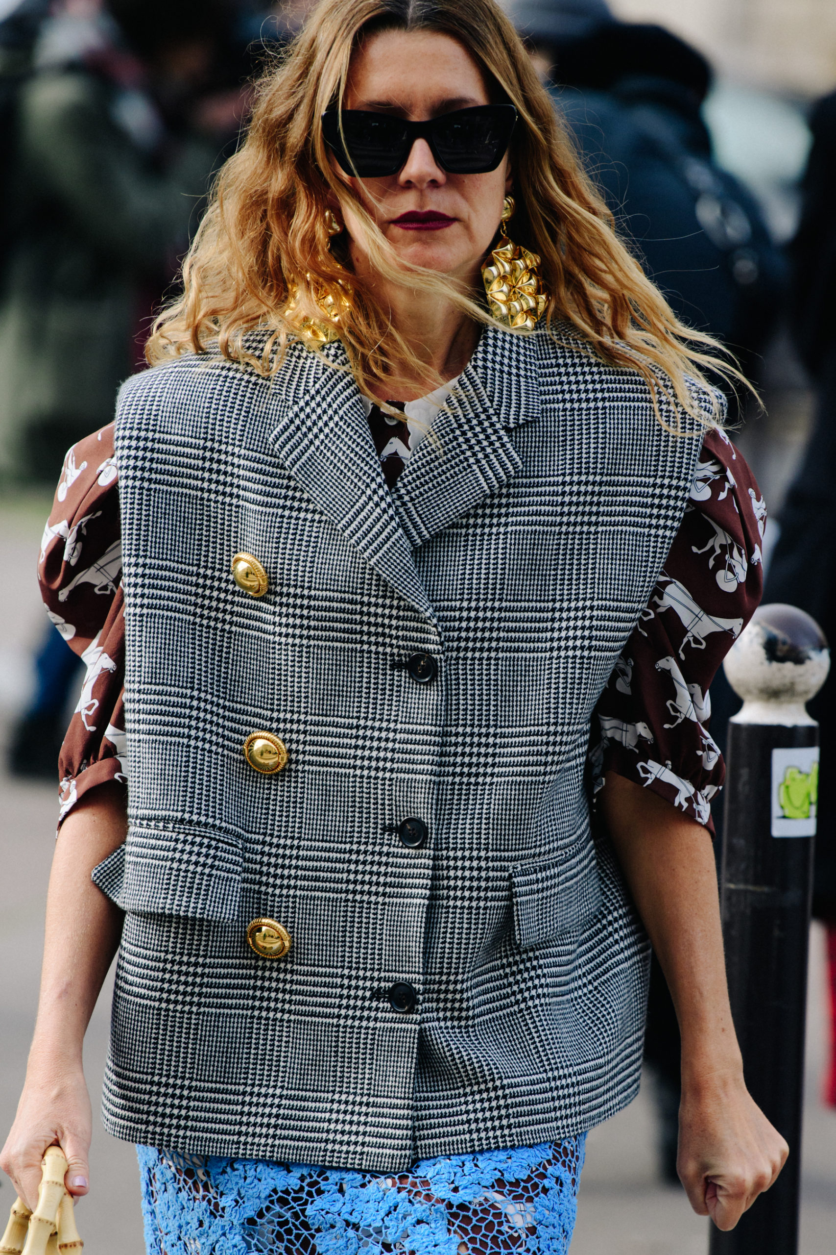 Woman wearing check vest