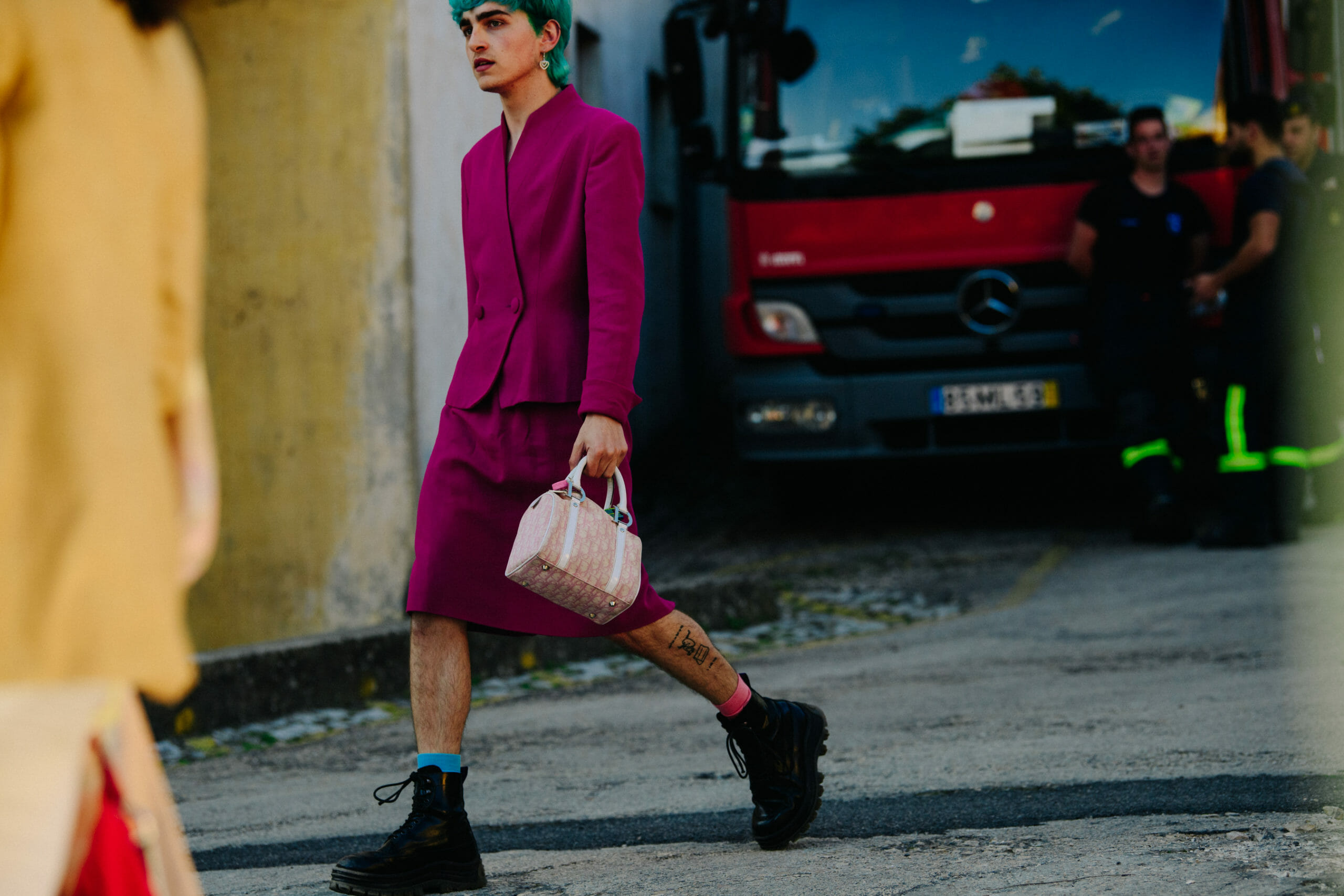 Man carrying pink bag