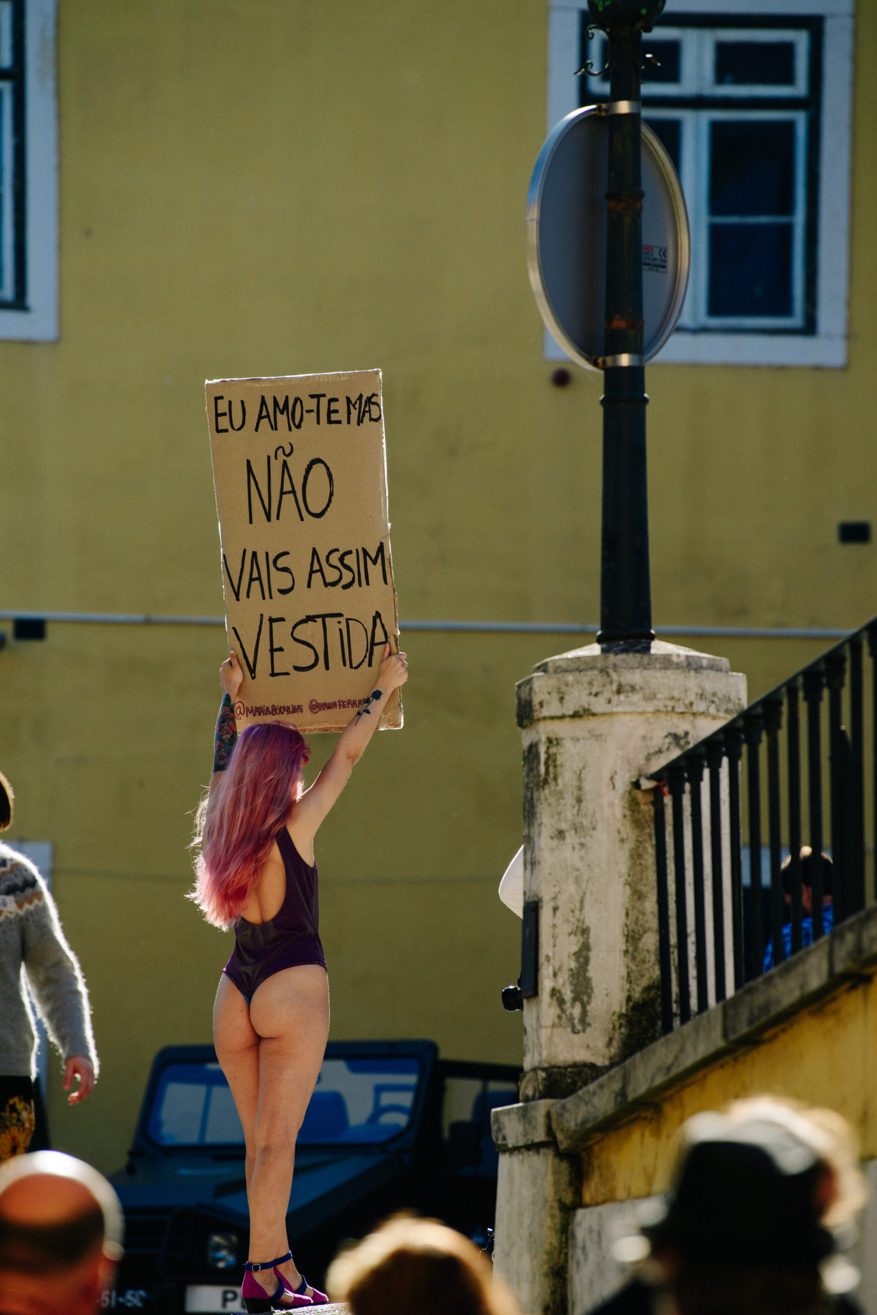 Woman holding sign