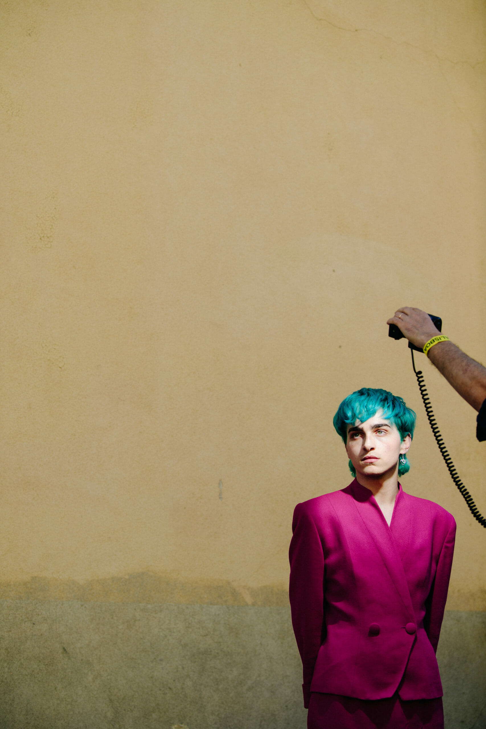 Man wearing pink suit