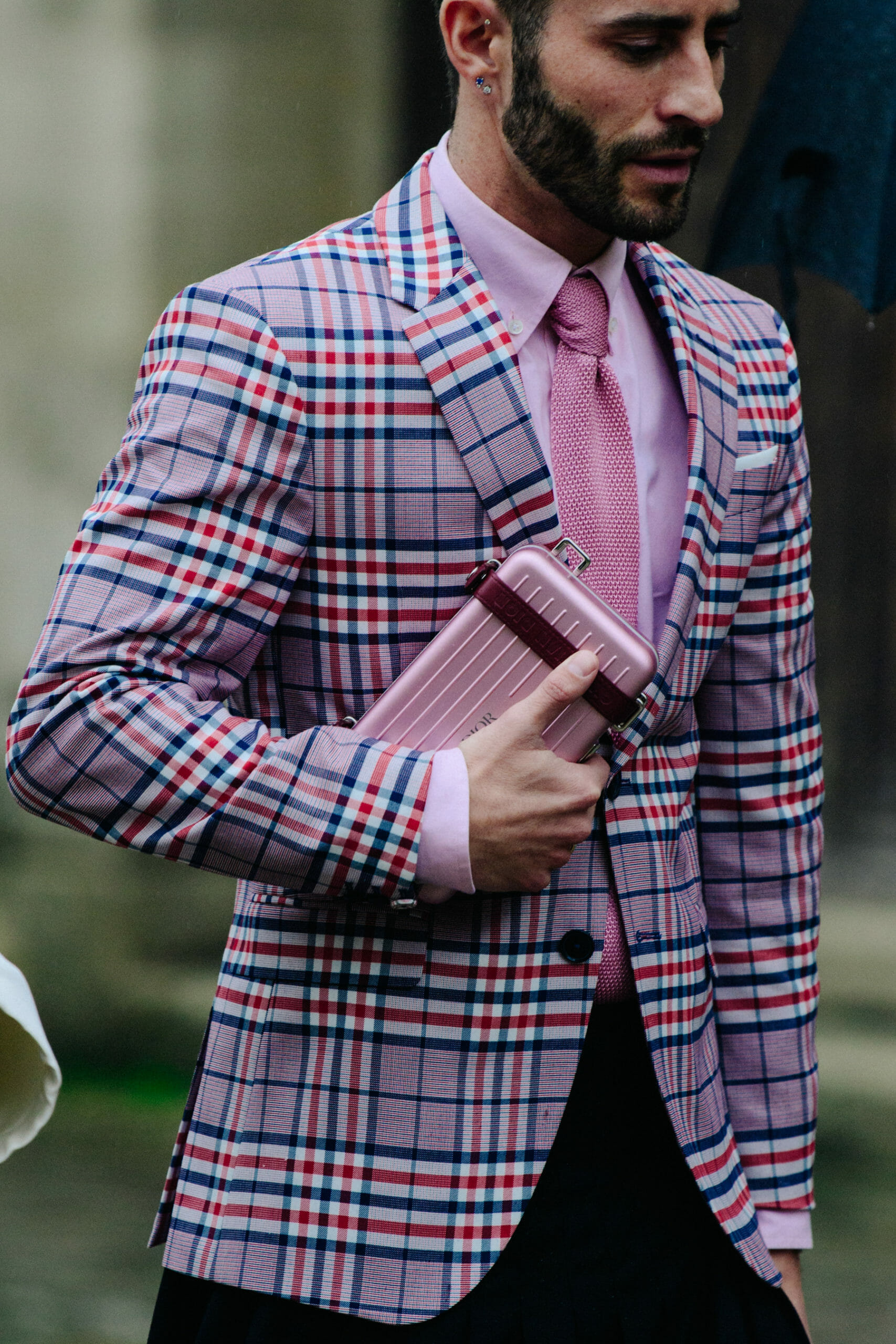 Man carrying Christian Dior bag