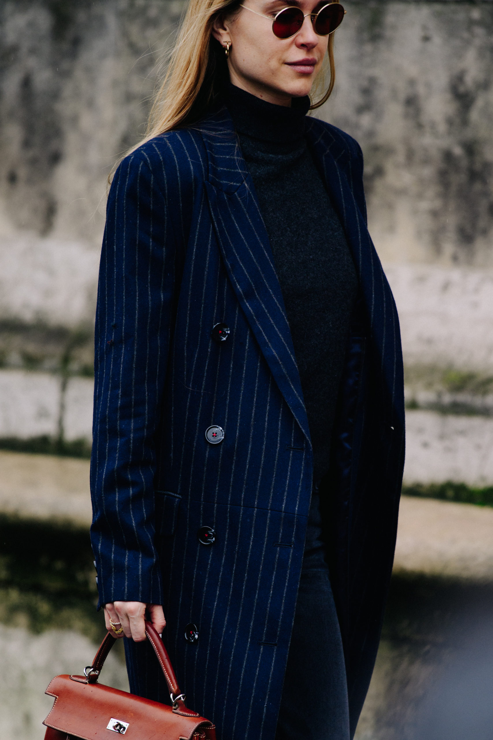 Woman wearing striped coat