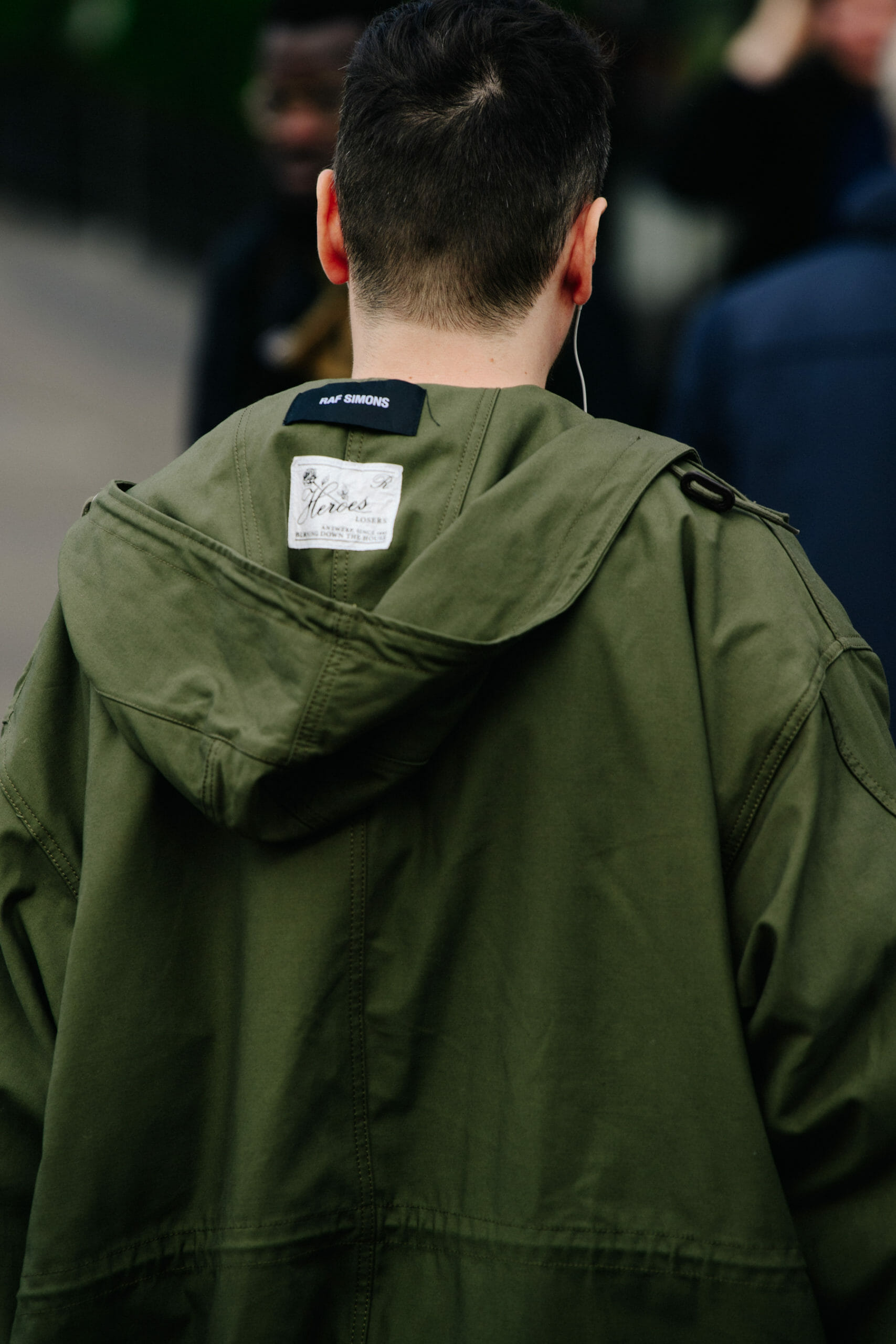 Man wearing Raf Simons coat