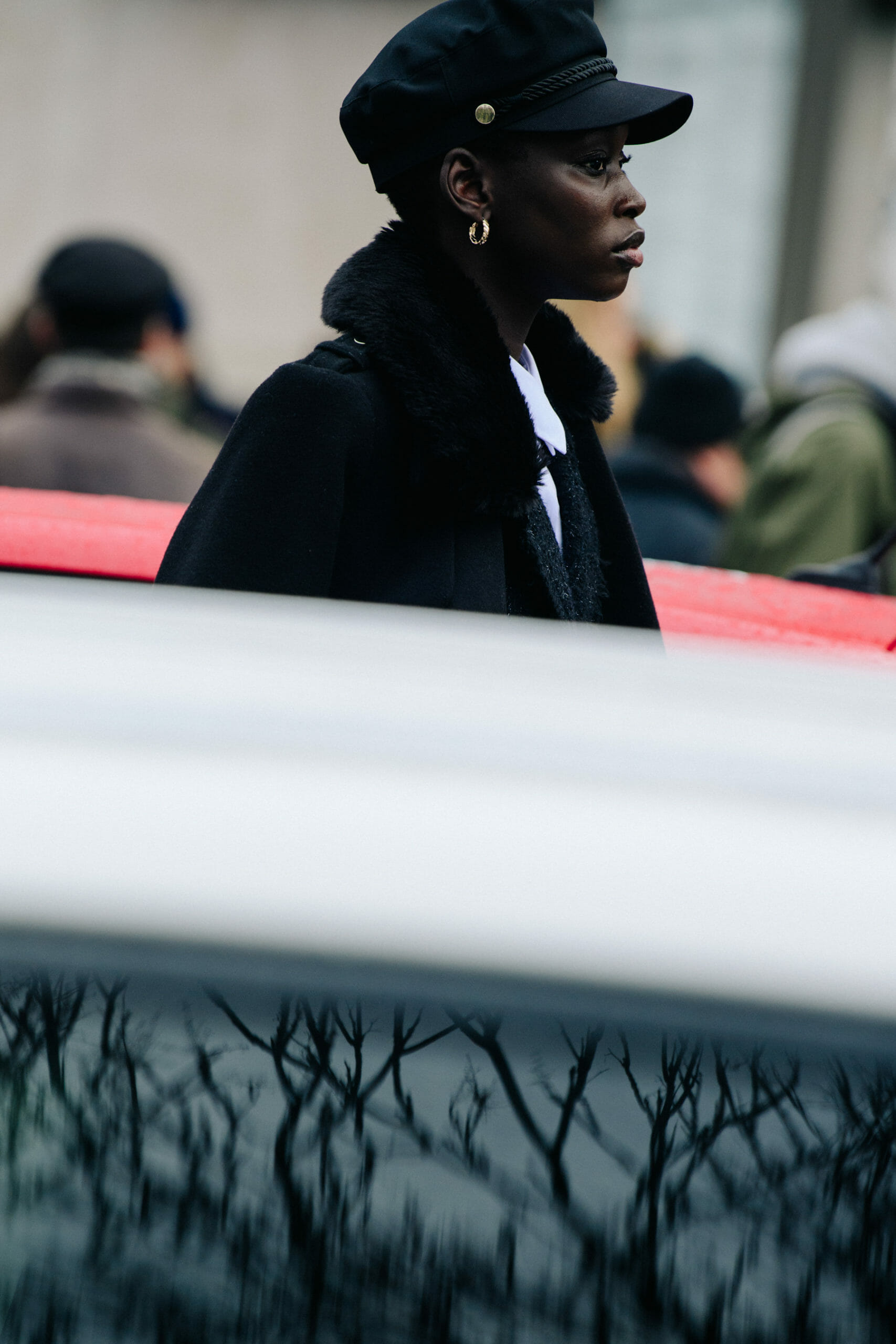 Model wearing black cap