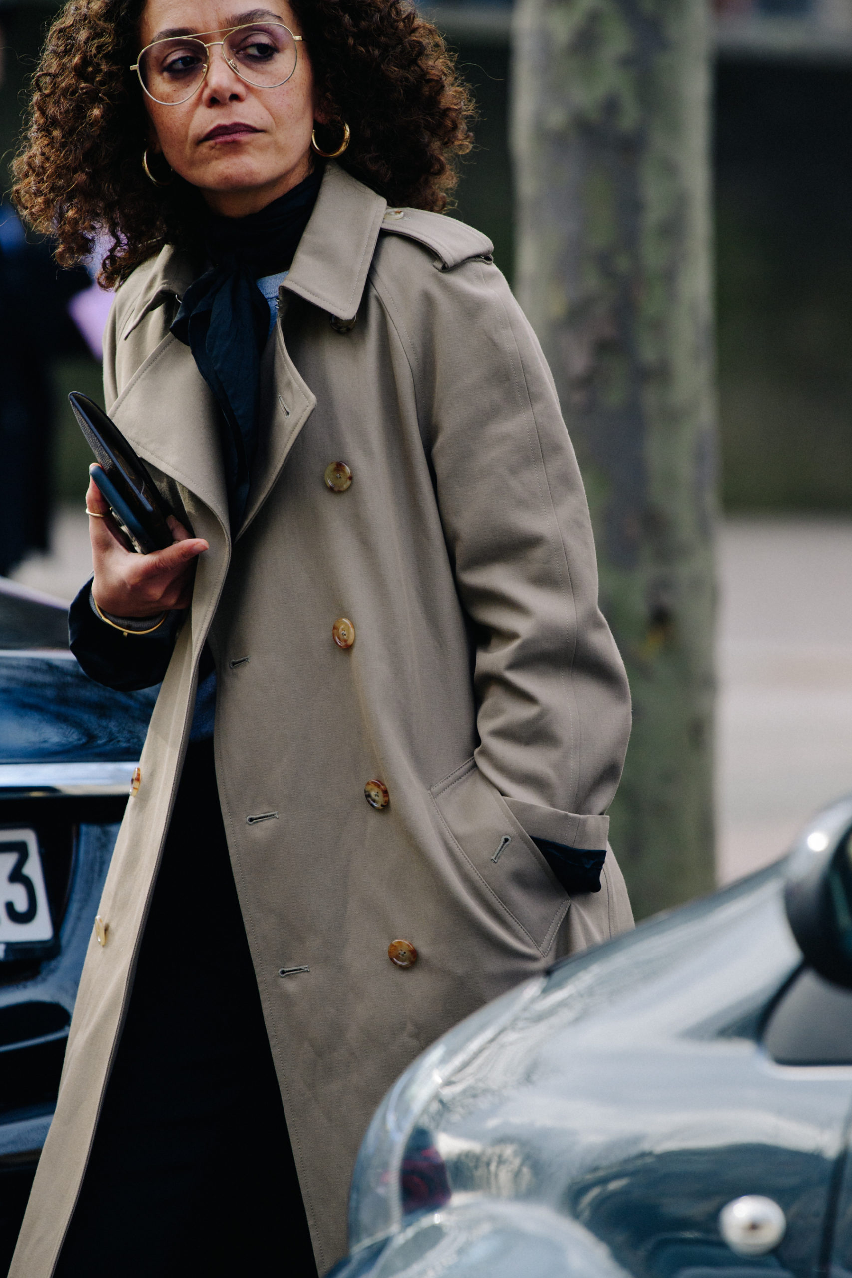 Woman wearing tan coat