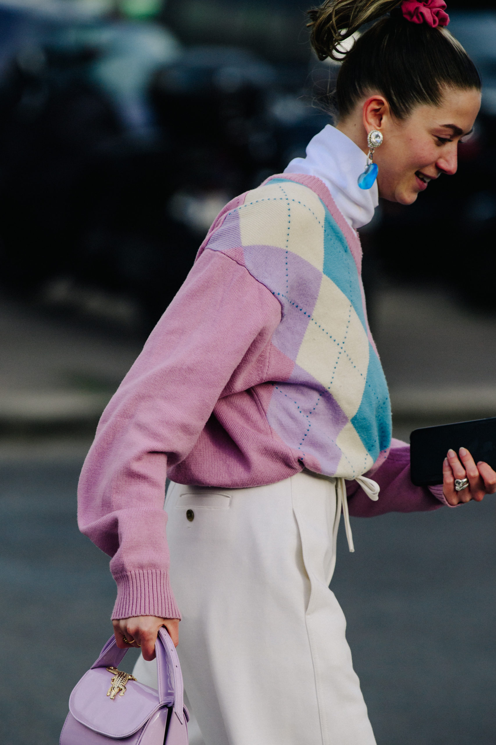 Woman wearing colourful jumper