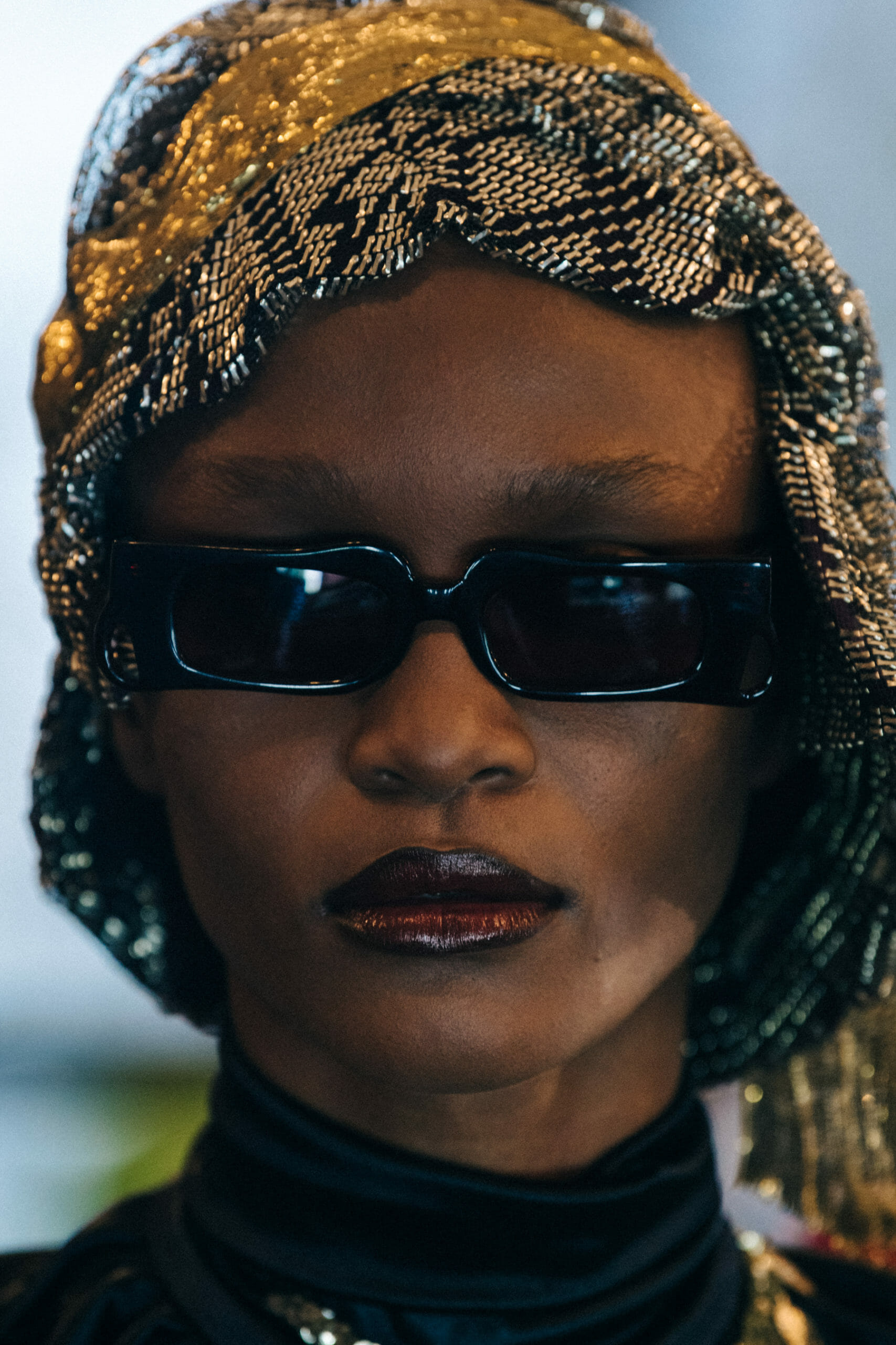 Model wearing dark sunglasses