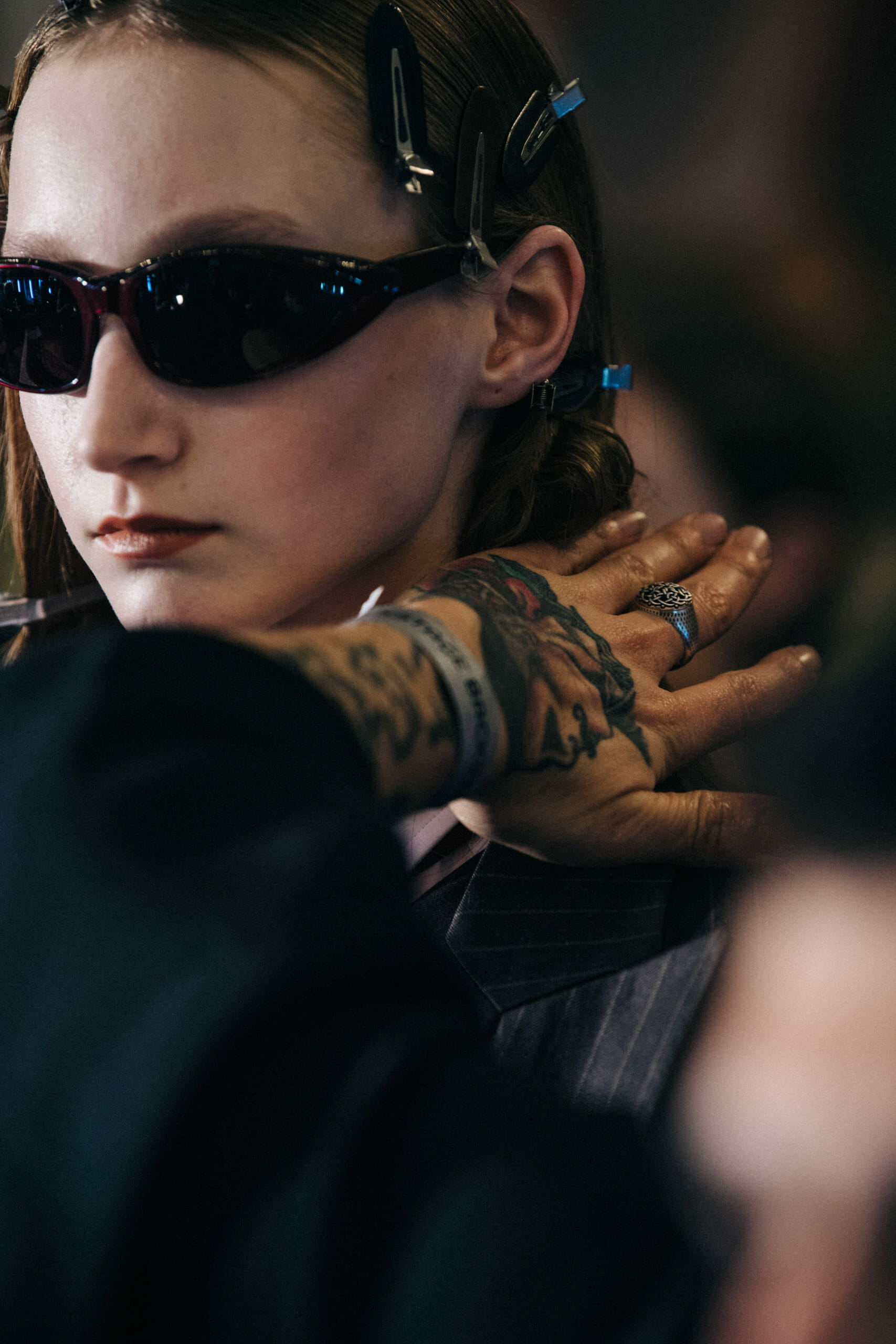 Model wearing dark sunglasses