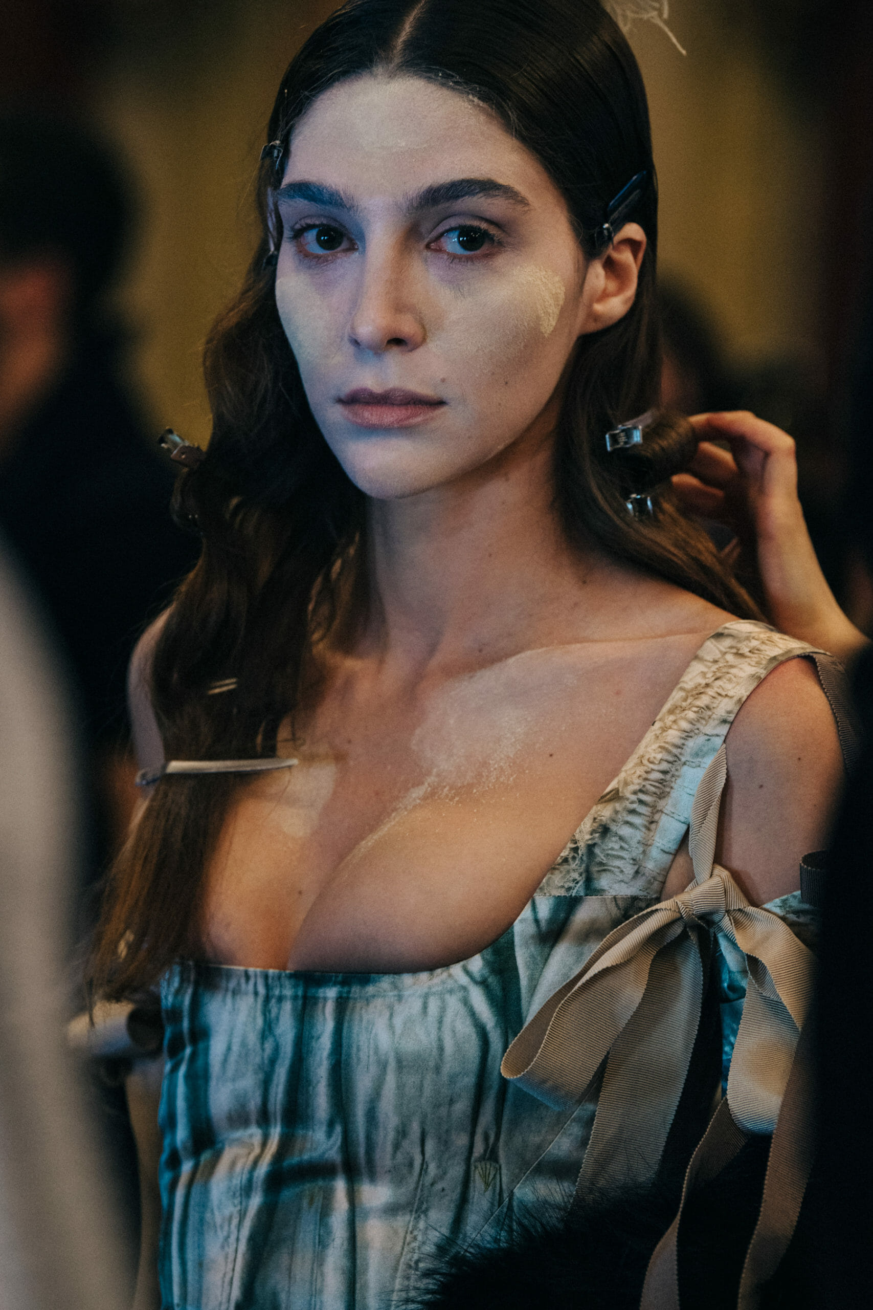 Model wearing silver dress