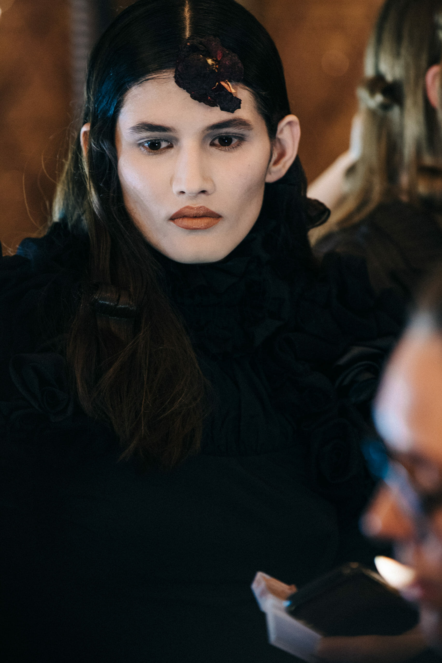 Model wearing black dress