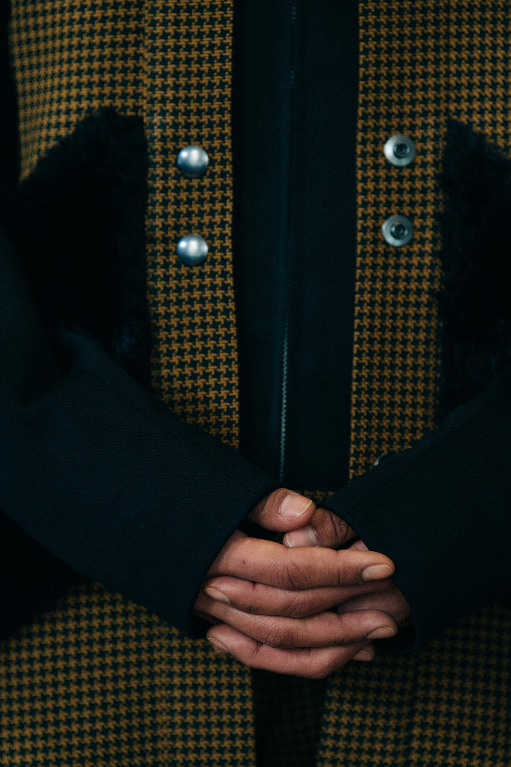 Model wearing yellow jacket