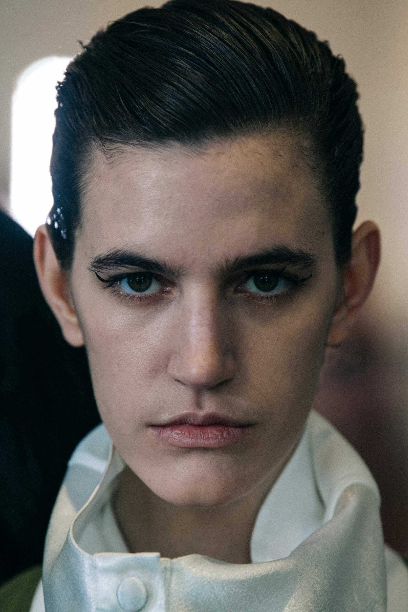 Model wearing white shirt