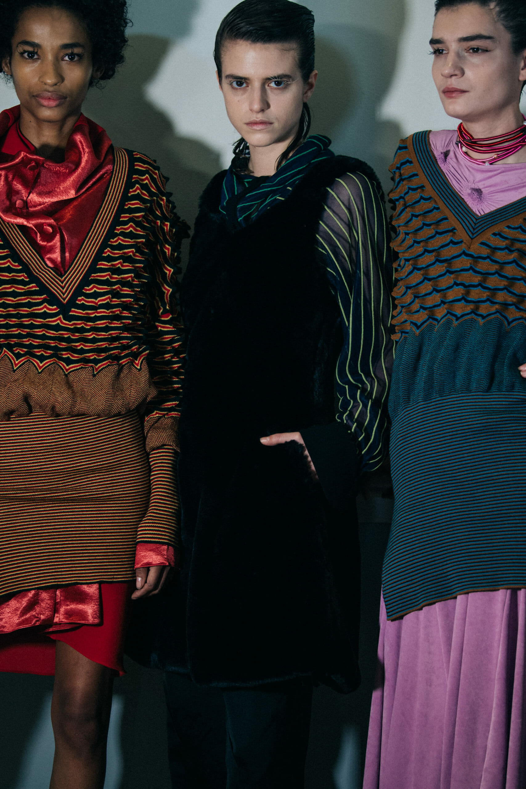 Models wearing colourful Kiko Kostadinov outfits