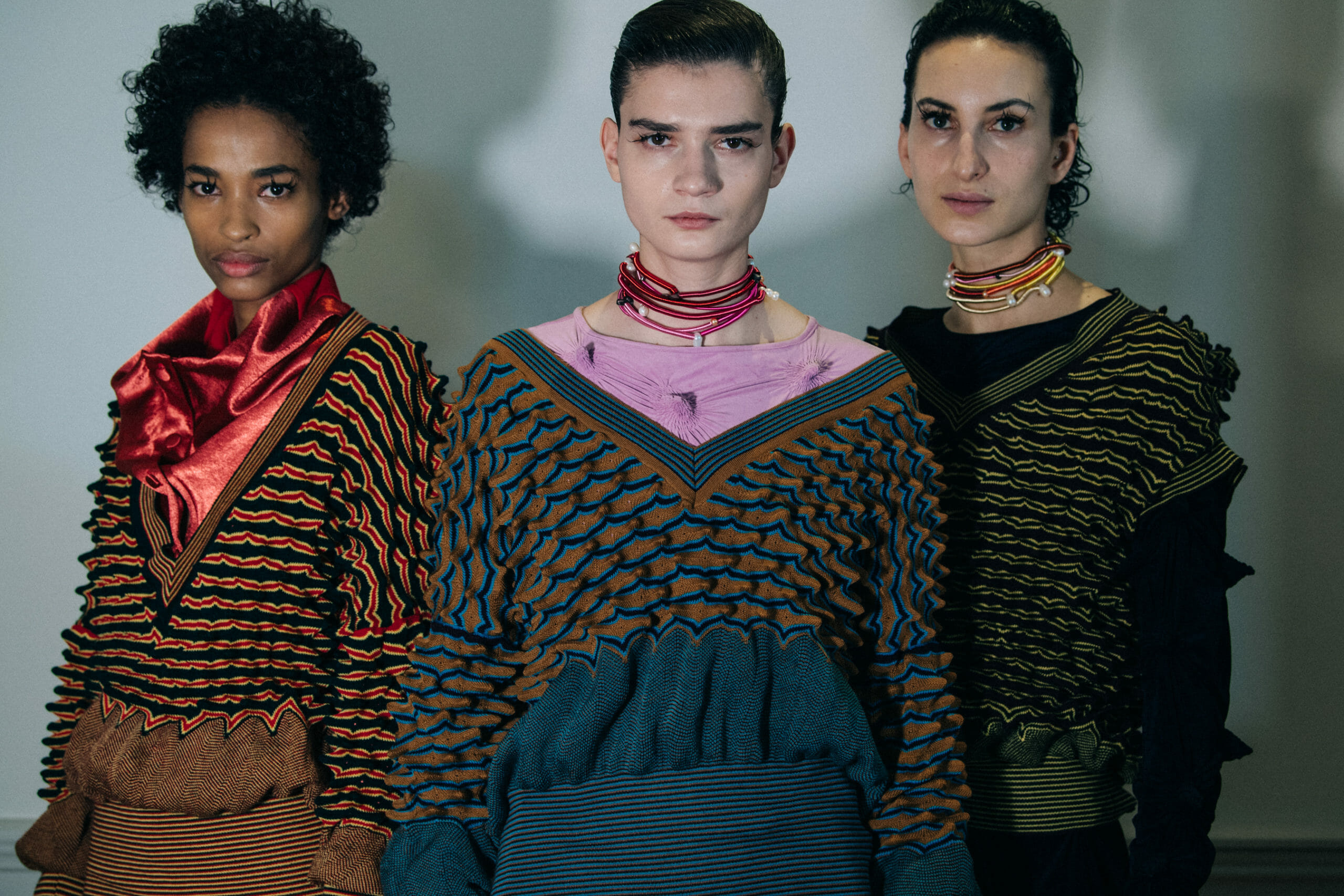 Models wearing colourful Kiko Kostadinov outfits