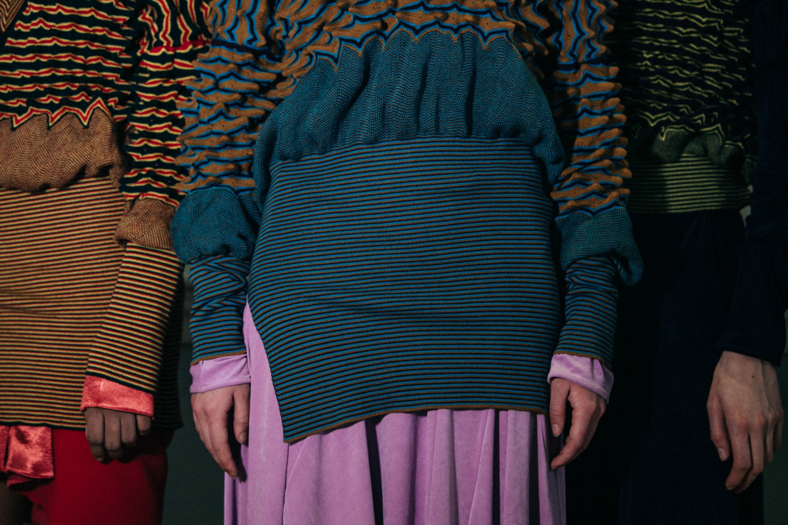 Models wearing colourful Kiko Kostadinov outfits