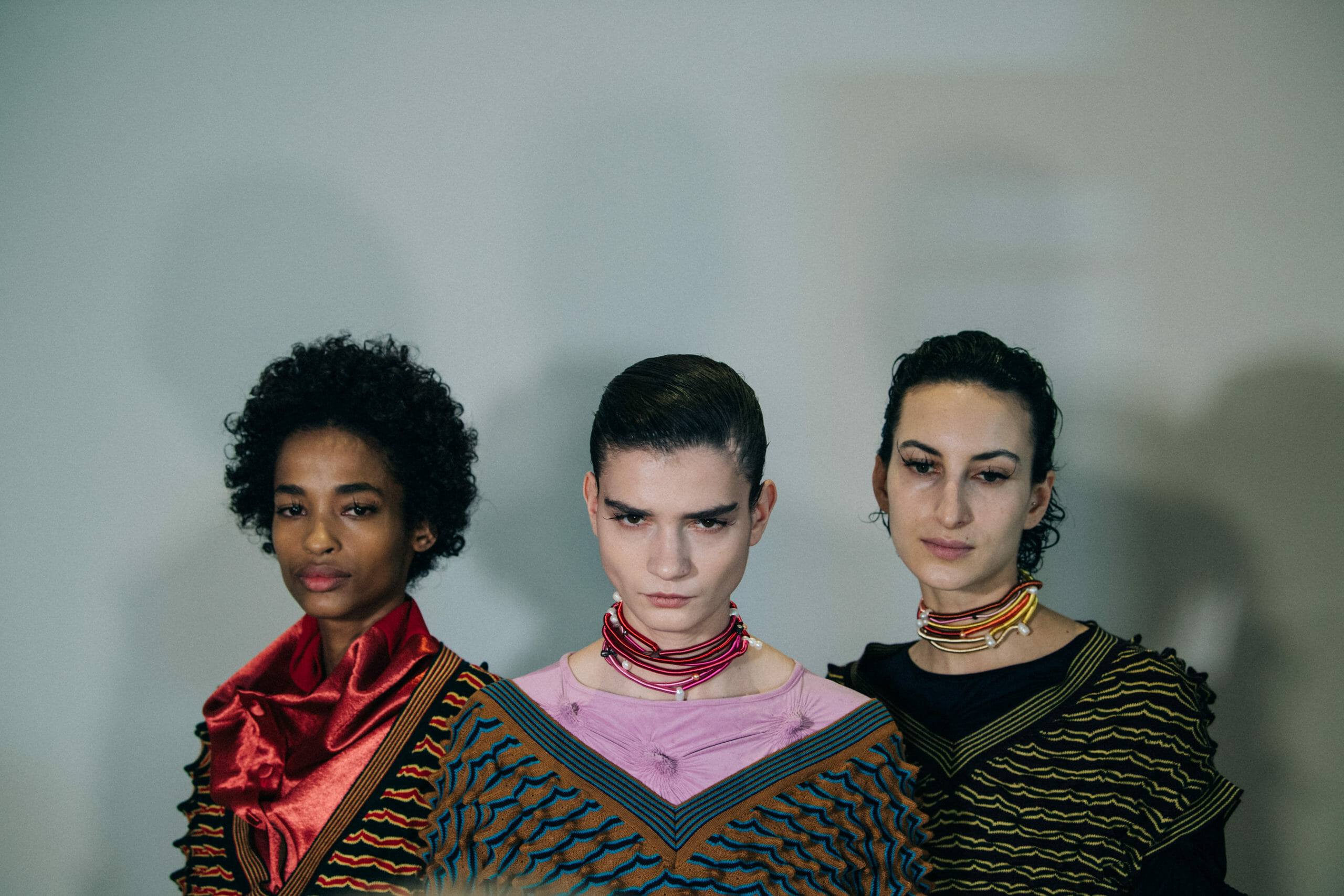 Models wearing colourful Kiko Kostadinov outfits