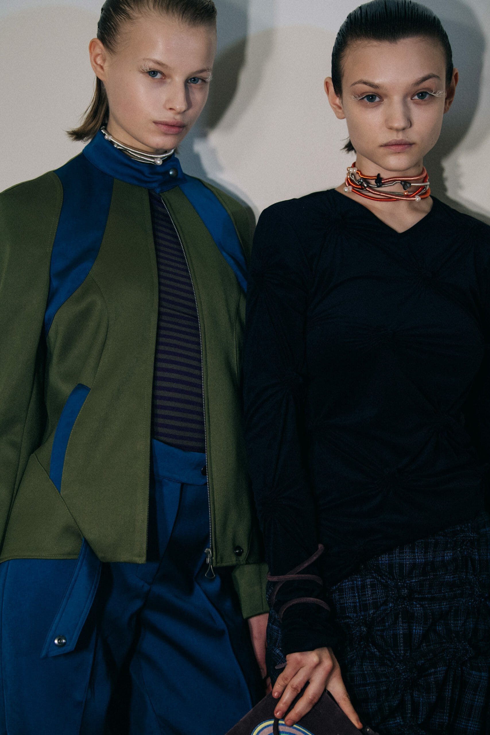 Models wearing dark Kiko Kostadinov outfits