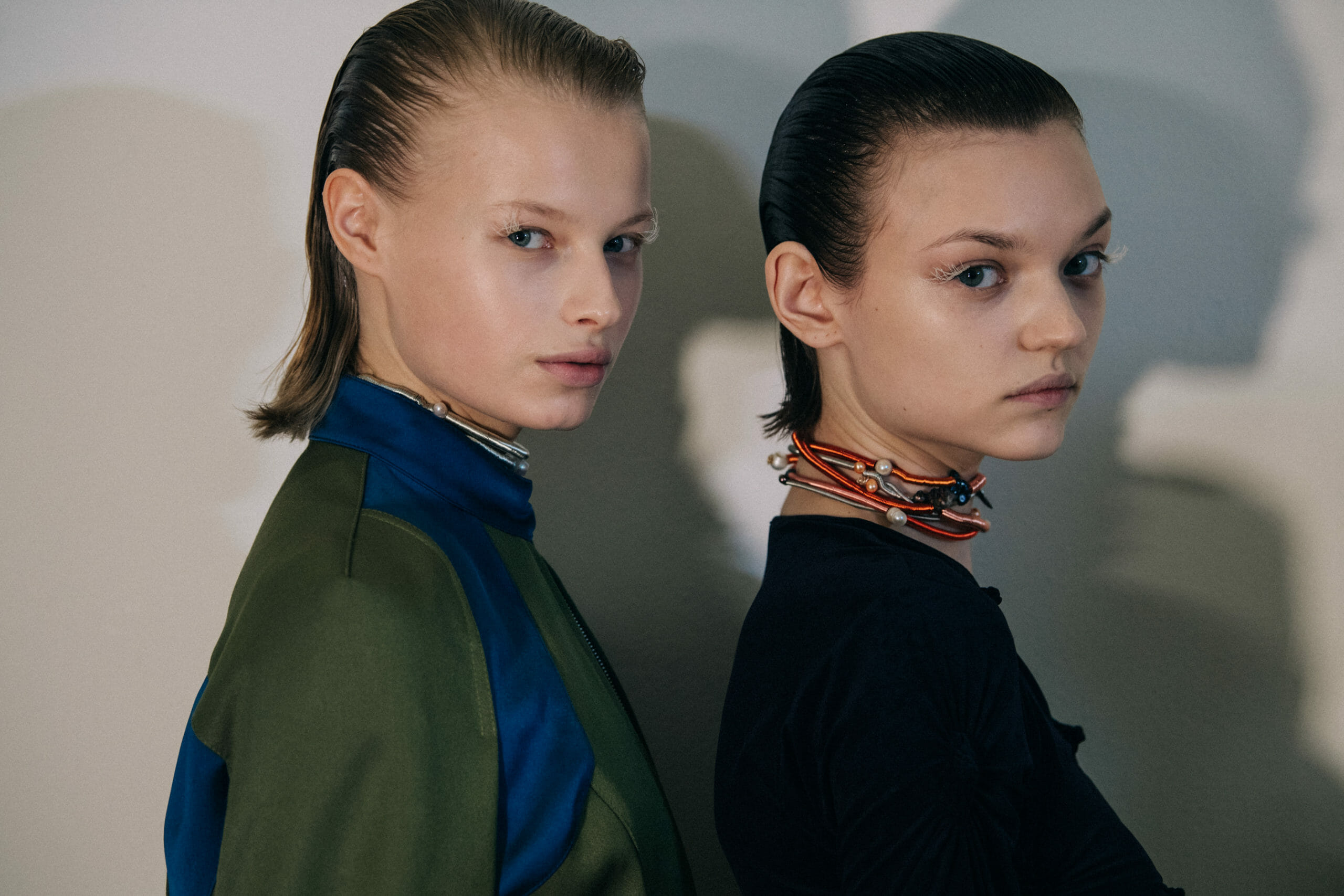 Models wearing dark Kiko Kostadinov outfits