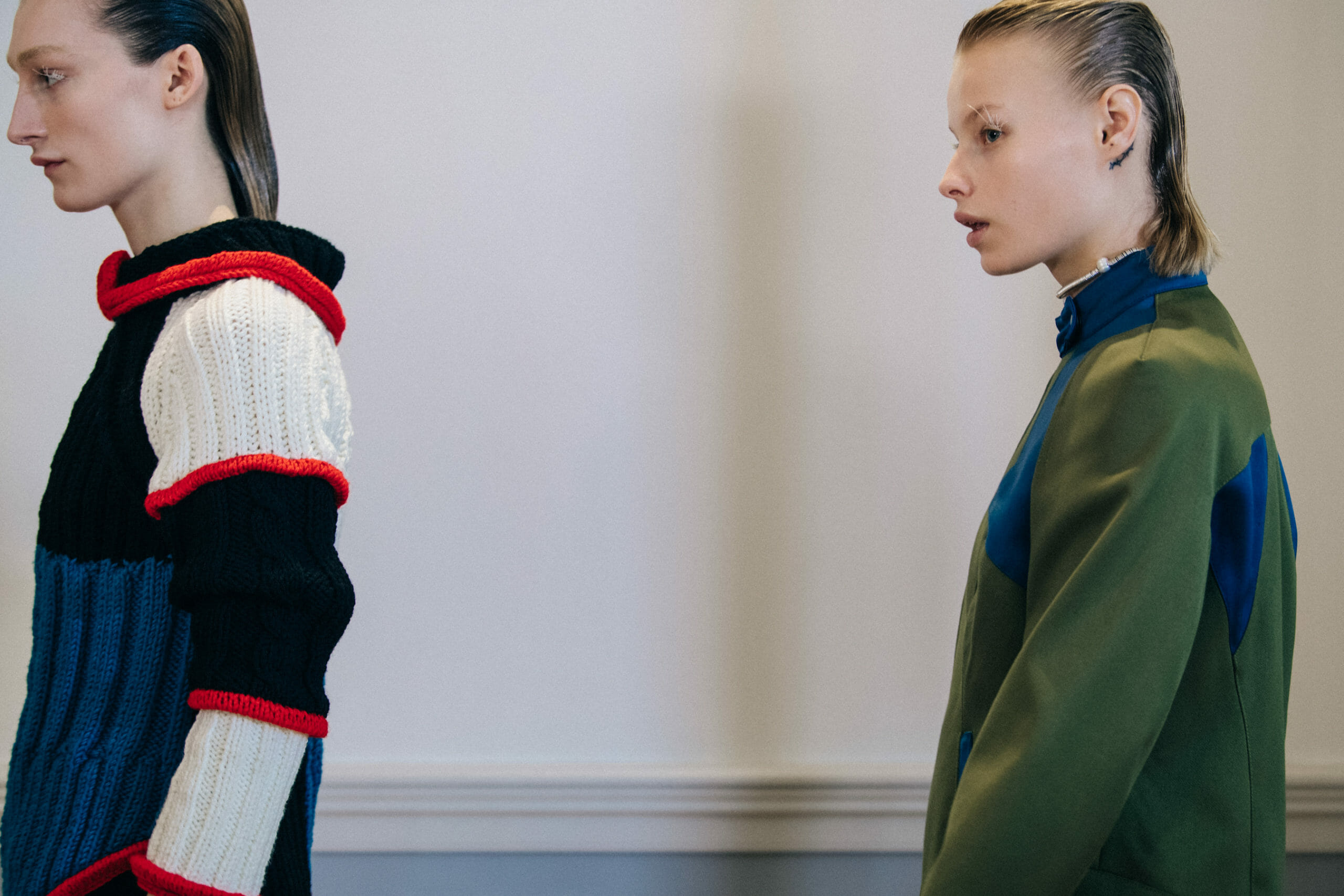 Models wearing dark Kiko Kostadinov outfits