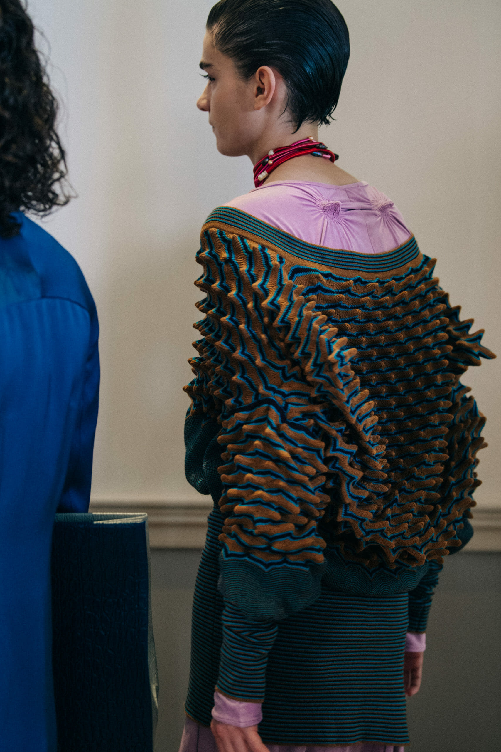 Models wearing colourful Kiko Kostadinov outfits